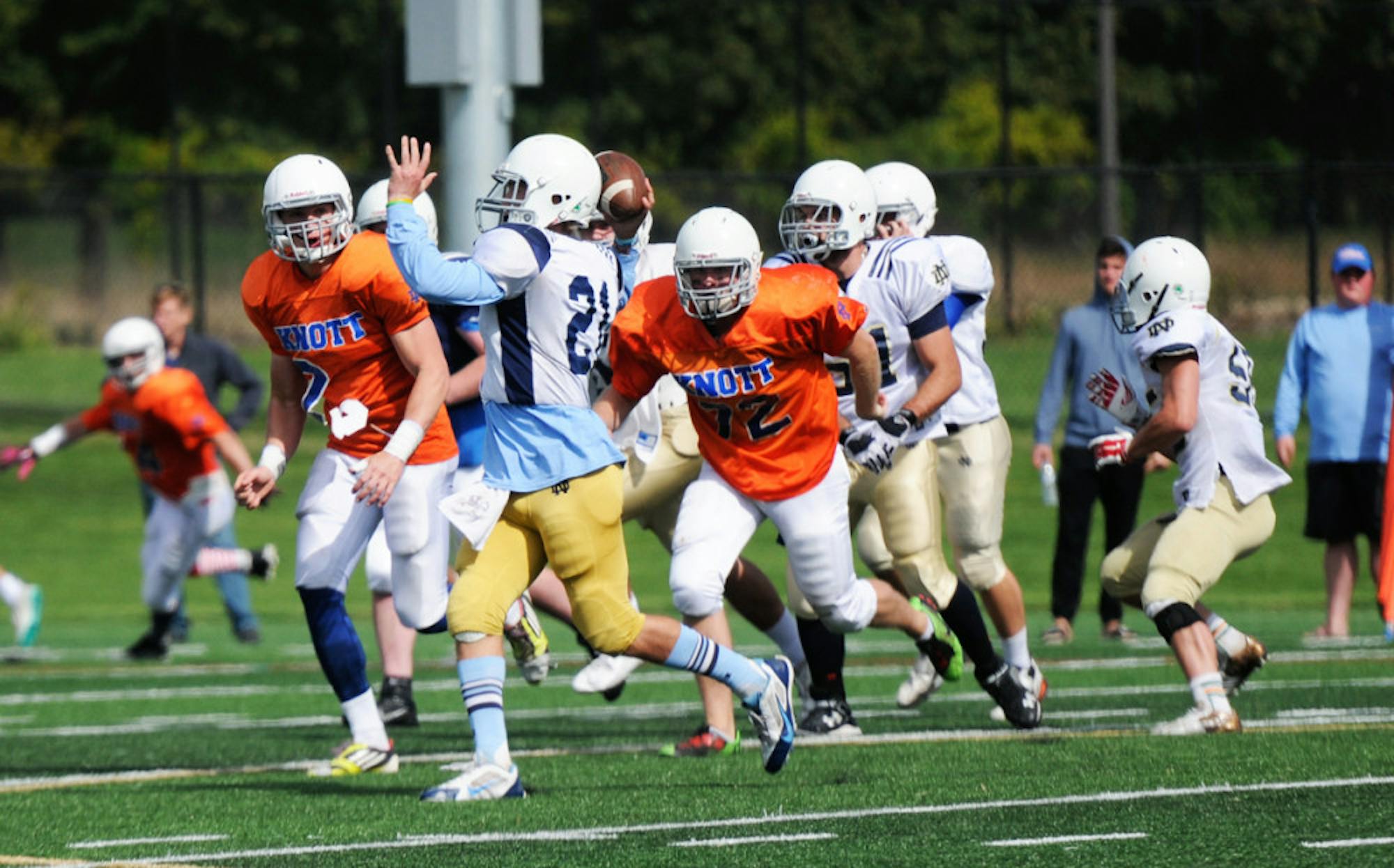 Otters sophomore quarterback Xavier Lezynski throws a pass while rolling out during Sorin’s 8-0 loss to Knott on Sunday.