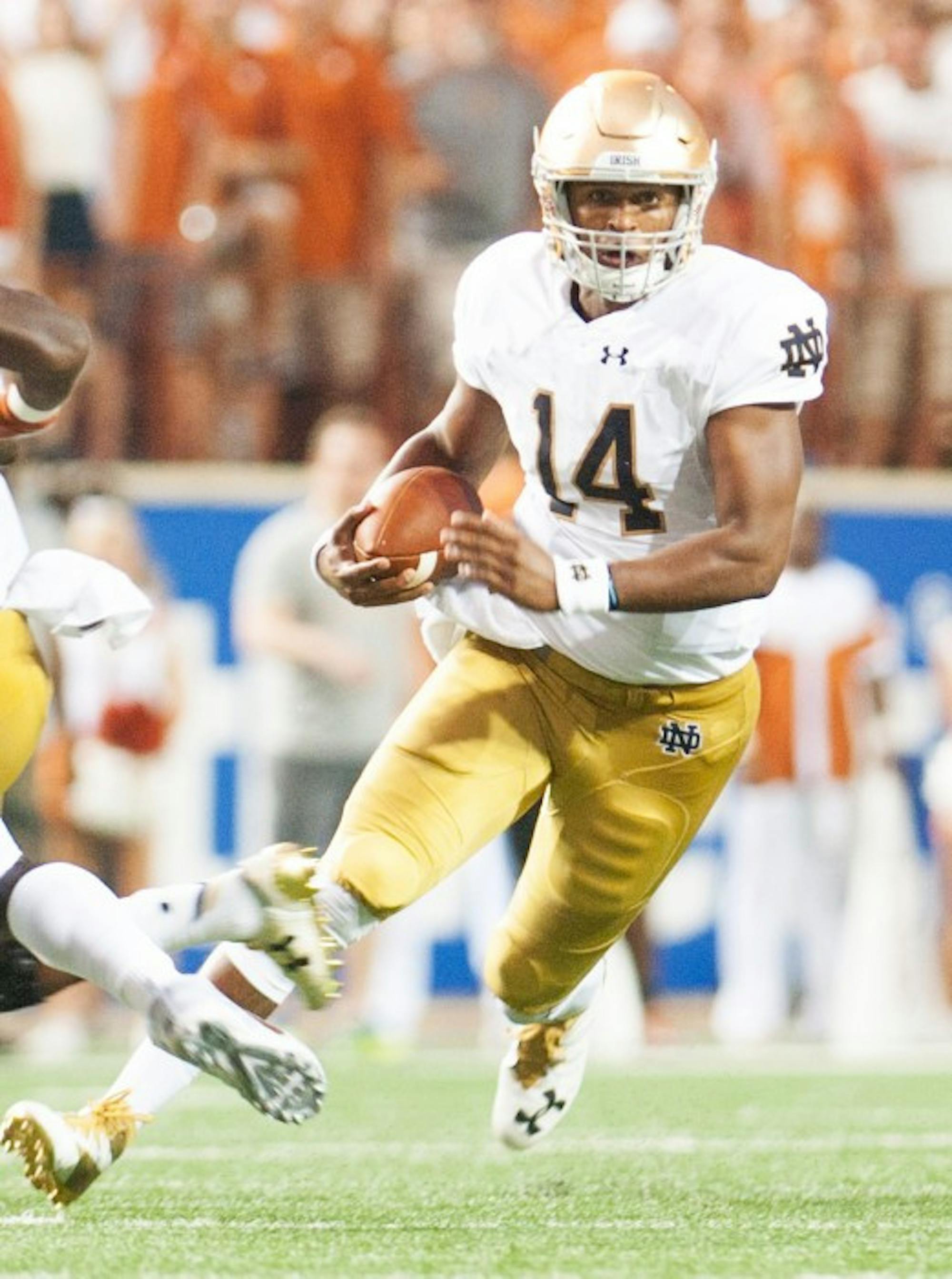 Irish junior quarterback DeShone Kizer rushes during Notre Dame’s 50-47 loss against Texas on Sunday at Darrell K. Royal–Texas Memorial Stadium. Kizer accounted for 36 of Notre Dame’s 47 points.