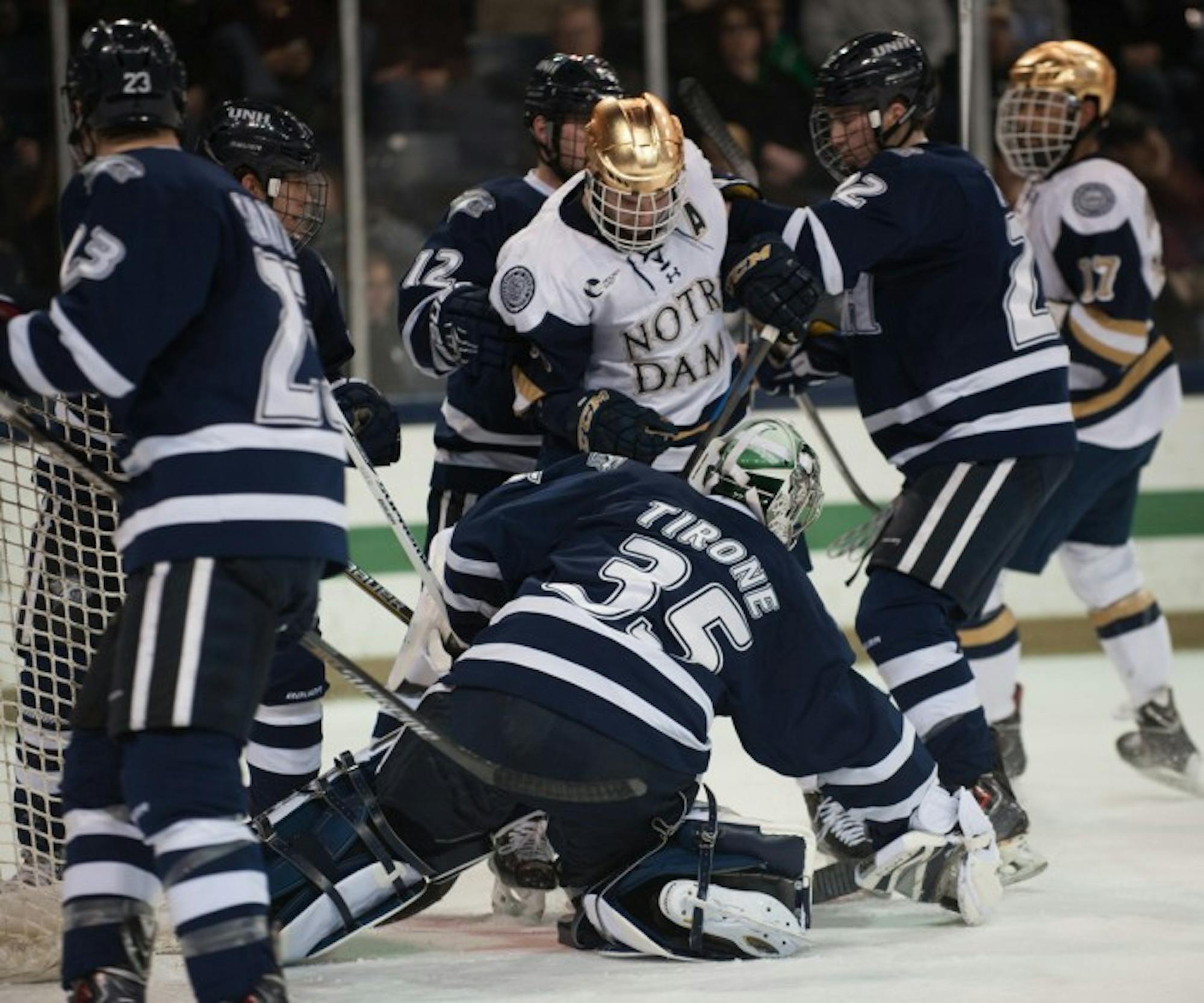 Irish senior right winger Peter Schneider scraps during Notre Dame's 5-2 loss to New Hampshire on Compton Family Ice Arena on Jan. 30.