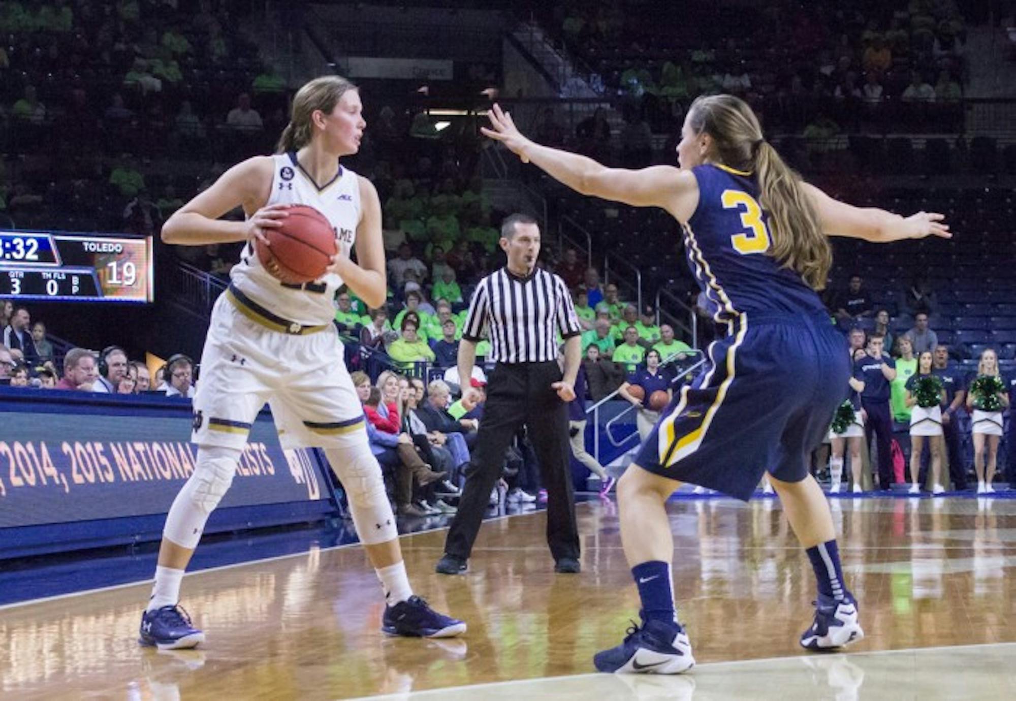 Graduate student guard Madison Cable looks for an open  teammate during Notre Dame’s 74-39 victory over Toledo on Wednesday.