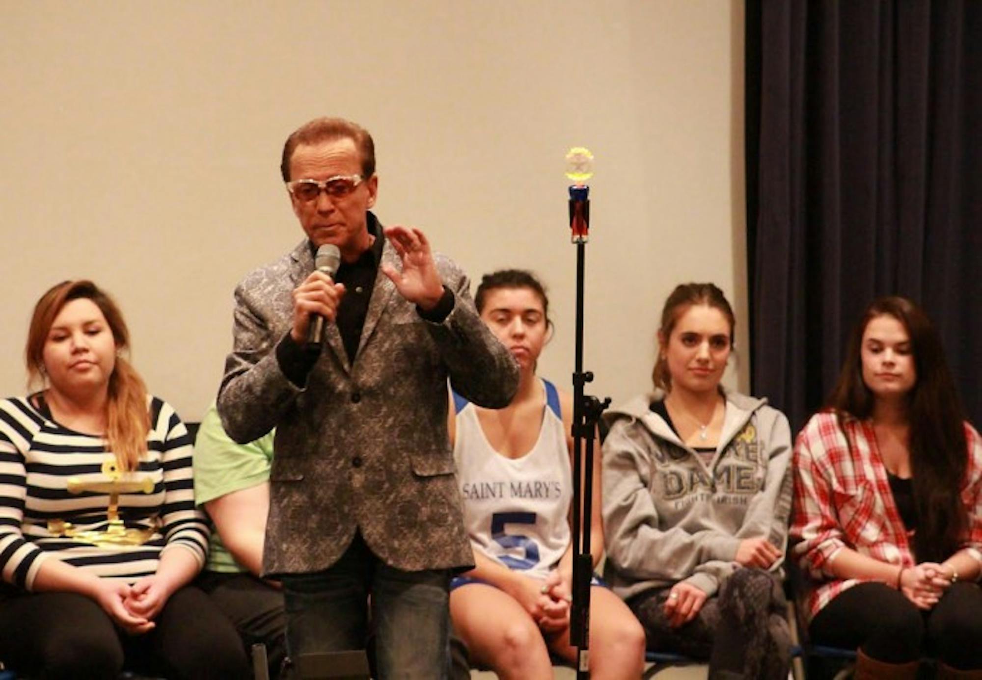 Dr. Jim Wand hypnotizes Saint Mary’s students. Wand has also worked with celebrities like Jay Leno and Conan O’ Brian.