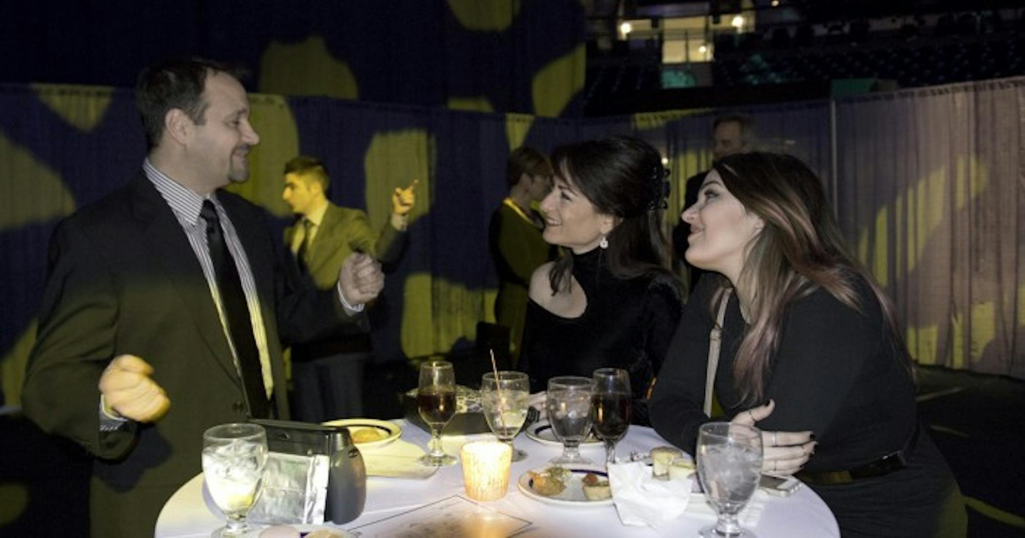 Junior Rachel Broghammer visits with her parents at the Gala held in Joyce Center on Friday evening as a part of the Junior Parents Weekend events.