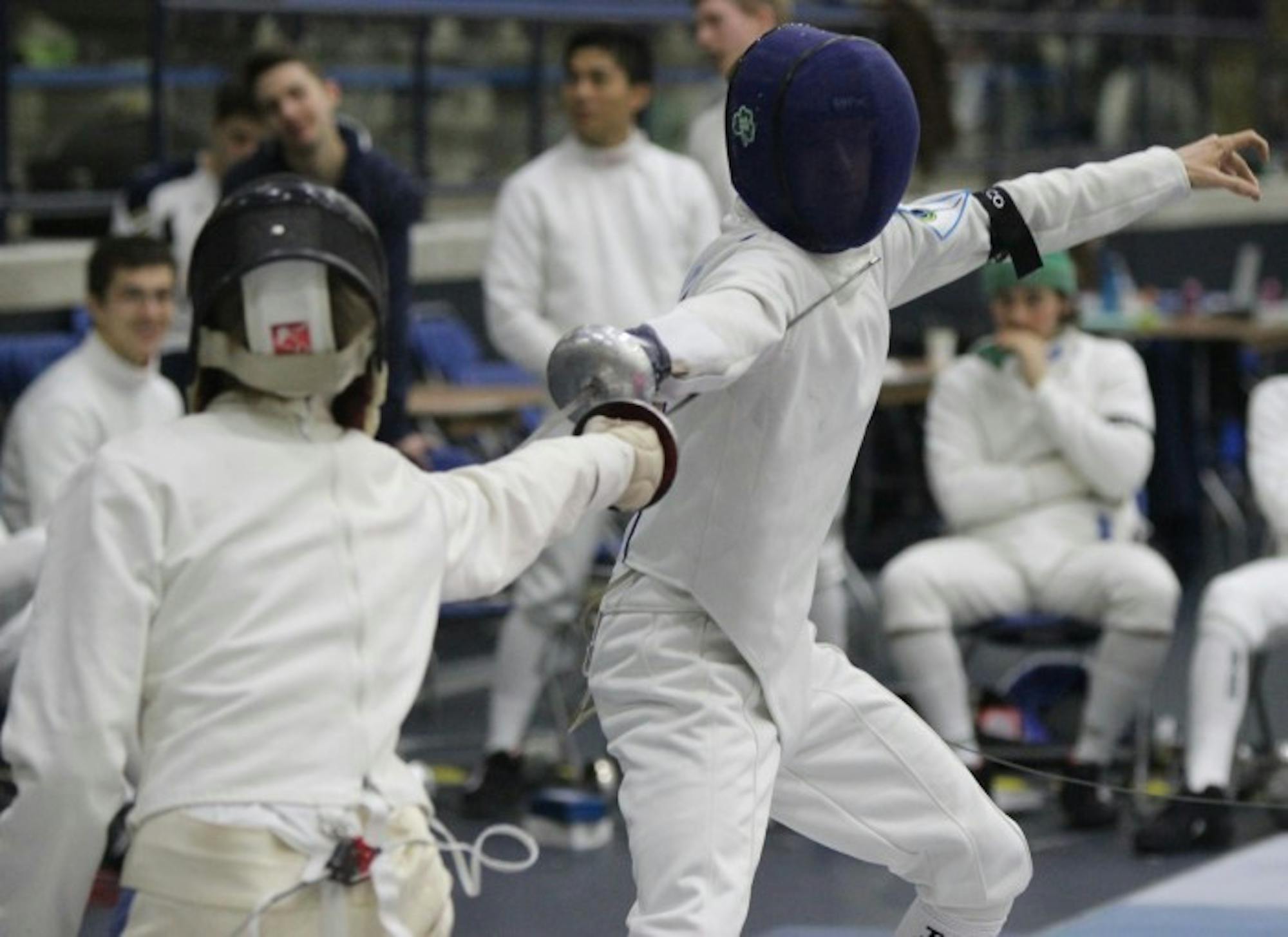 Sophomore epee John Pietrowicz lunges during the DeCicco Duals at Joyce Fieldhouse on Feb. 9.