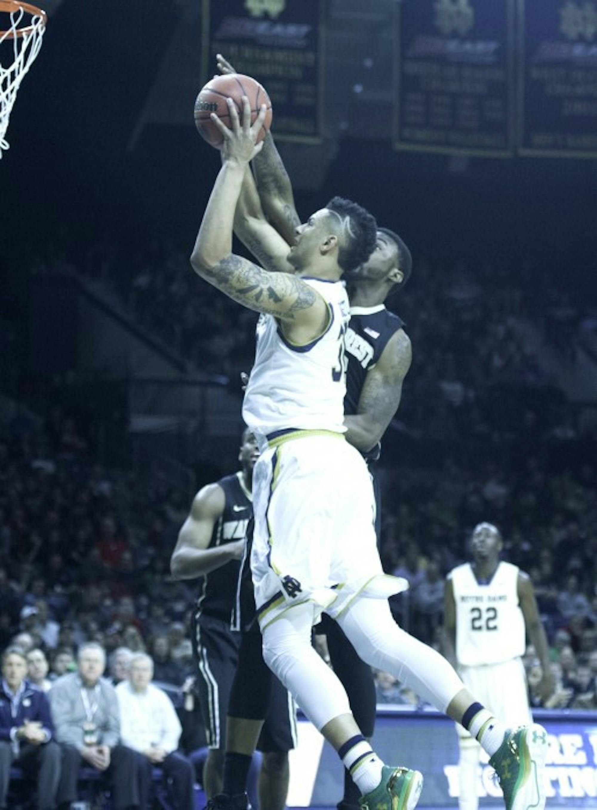 Irish junior forward Zach Auguste goes up for a contested shot in Notre Dame’s 88-75 victory over Wake Forest on Feb. 17.