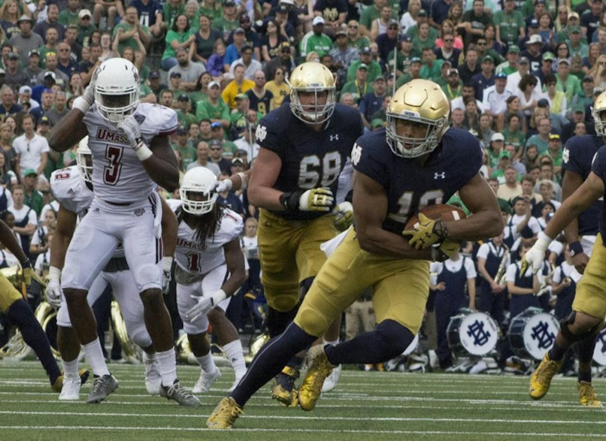Freshman tight end Alizé Jones runs in space following a reception during Notre Dame’s 62-27 win over Massachusetts. Jones was one of eight Irish players to catch a pass in Saturday’s victory.