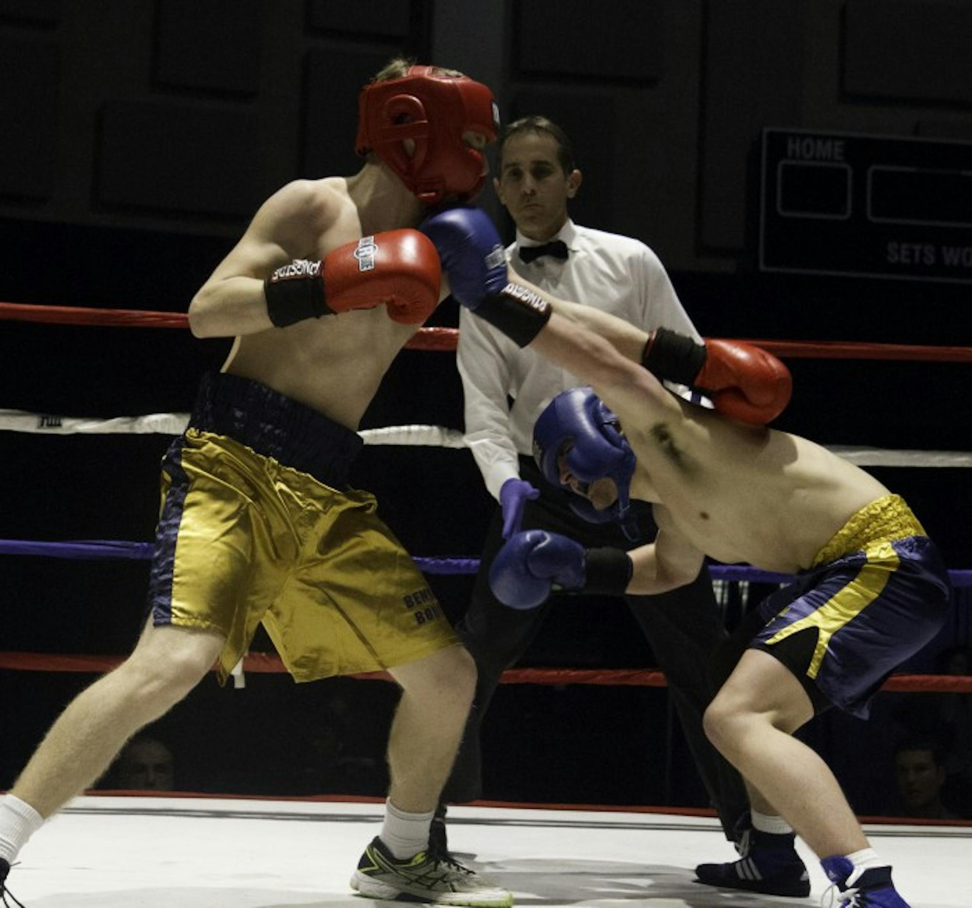 Freshman Jonny Biagini, right, ducks to avoid a punch from freshman Ian Salzman during the prelimary round of the 87th annual Bengal Bouts tournament on Tuesday at the Joyce Athletic and Convocation Center.