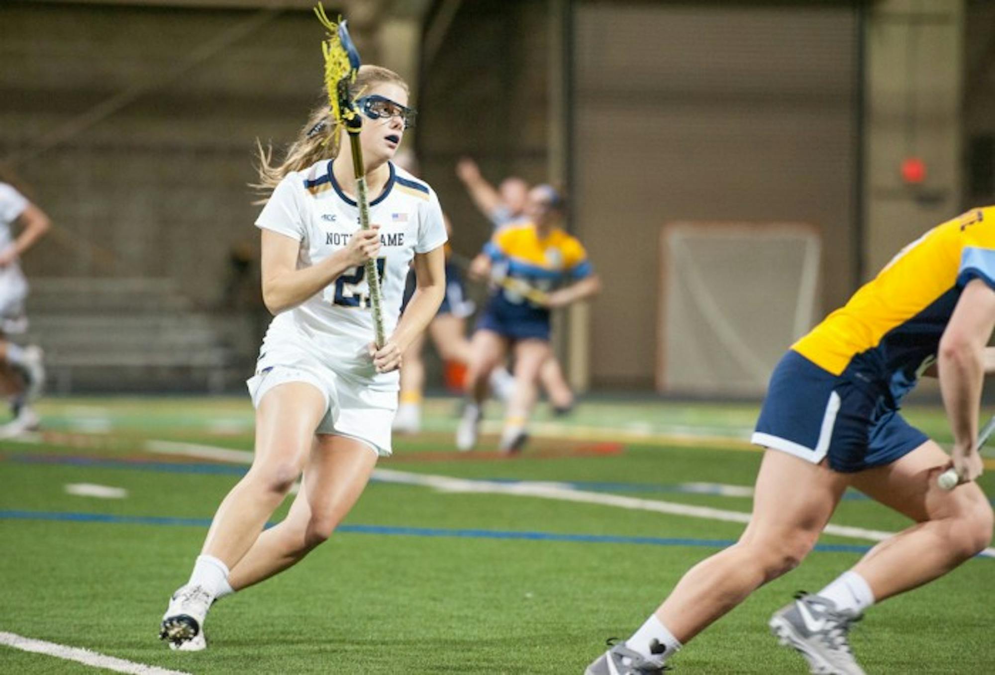Irish senior attack Grace Muller cradles the ball during Notre Dame’s 21-9 win over Marquette on Feb. 14 at Loftus Sports Center.