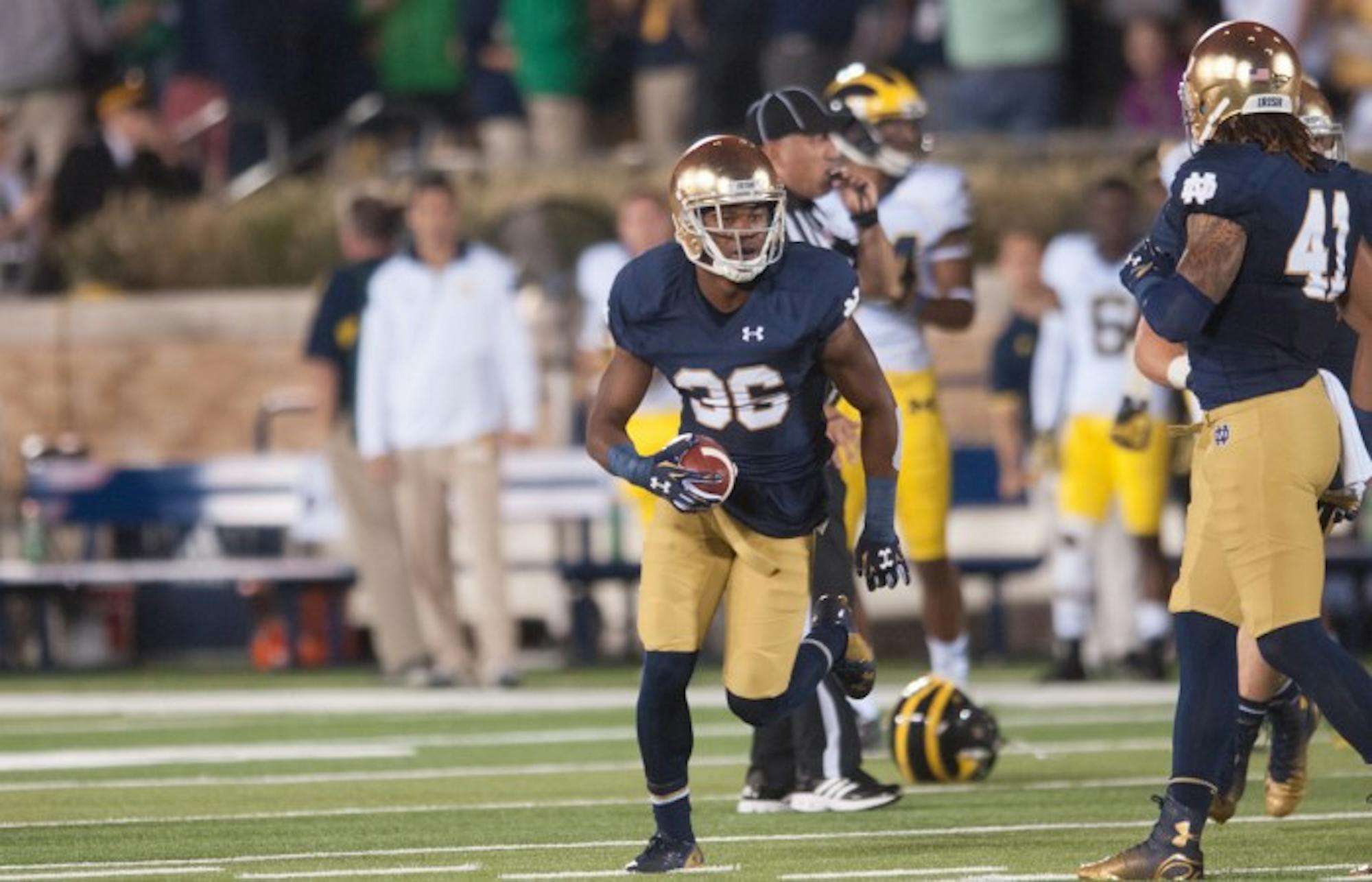 Irish sophomore cornerback Cole Luke turns downfield during Notre Dame’s 31-0 victory over Michigan on Saturday. Luke had a near-interception against the Wolverines.
