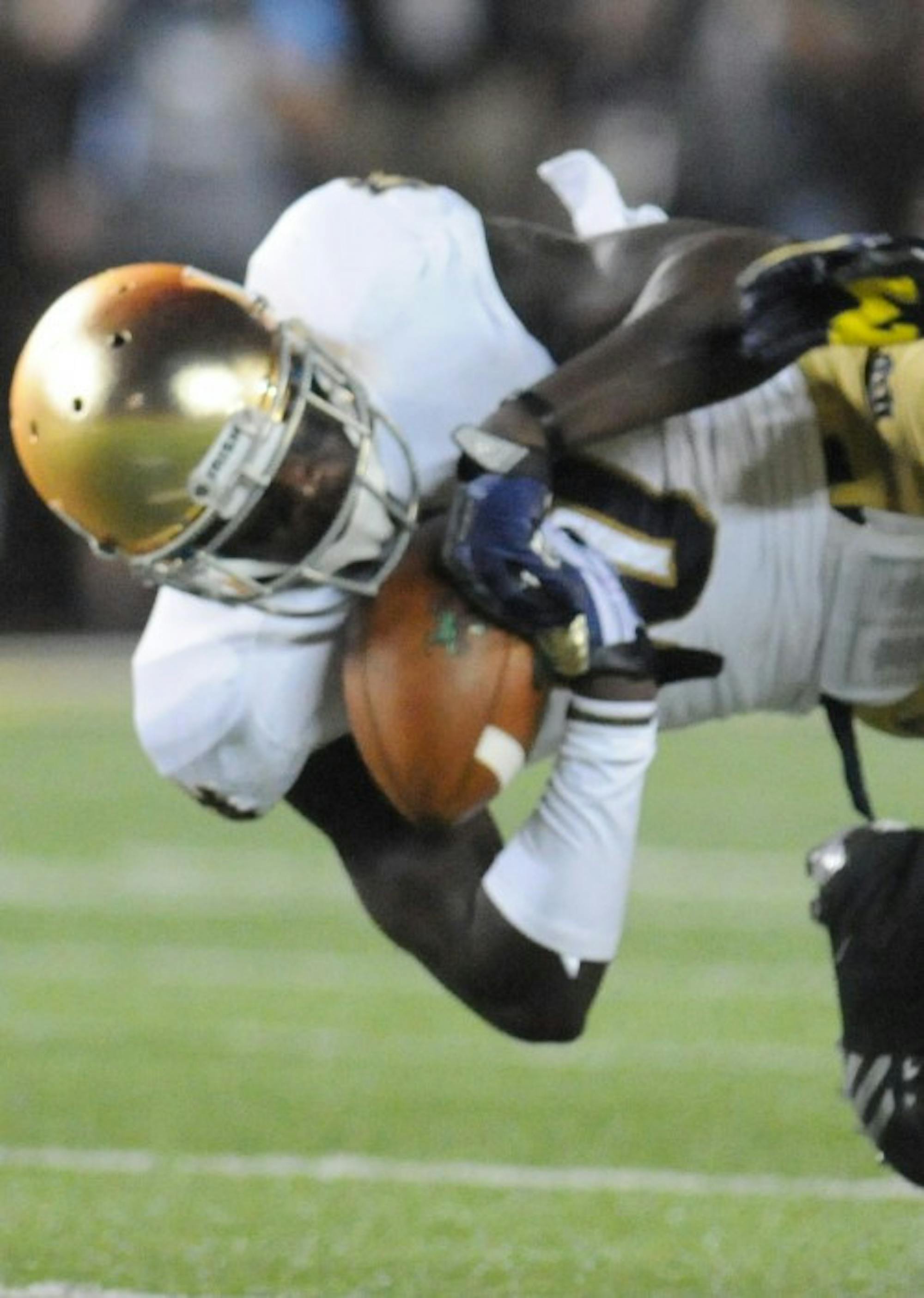 Irish senior wide receiver DaVaris Daniels catches a pass during Notre Dame’s 41-30 loss against Michigan last season on Sept. 7 .
