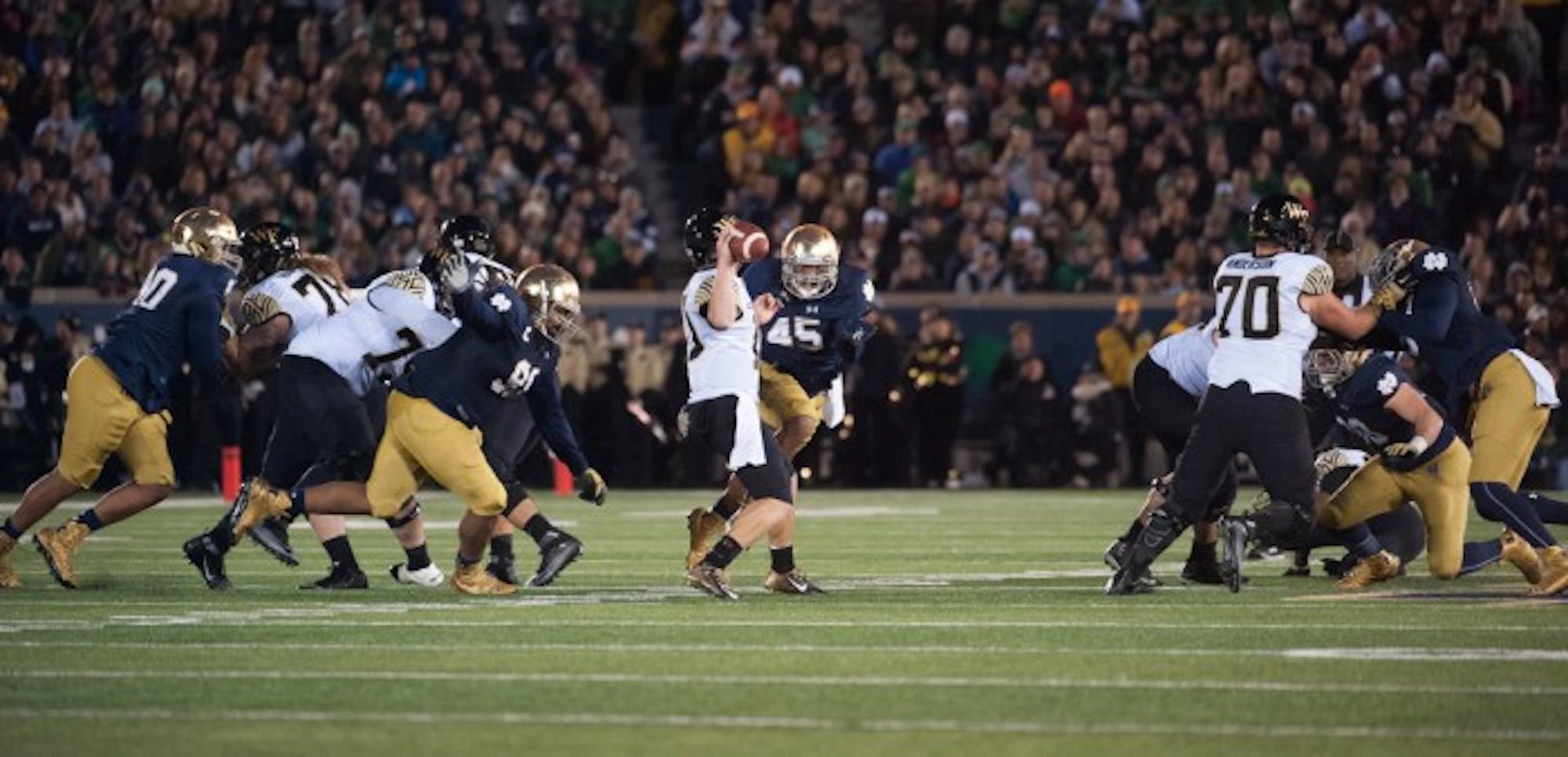 Senior defensive lineman Romeo Okwara pressures the quarterback during Notre Dame’s 28-7 victory over Wake Forest on Saturday.