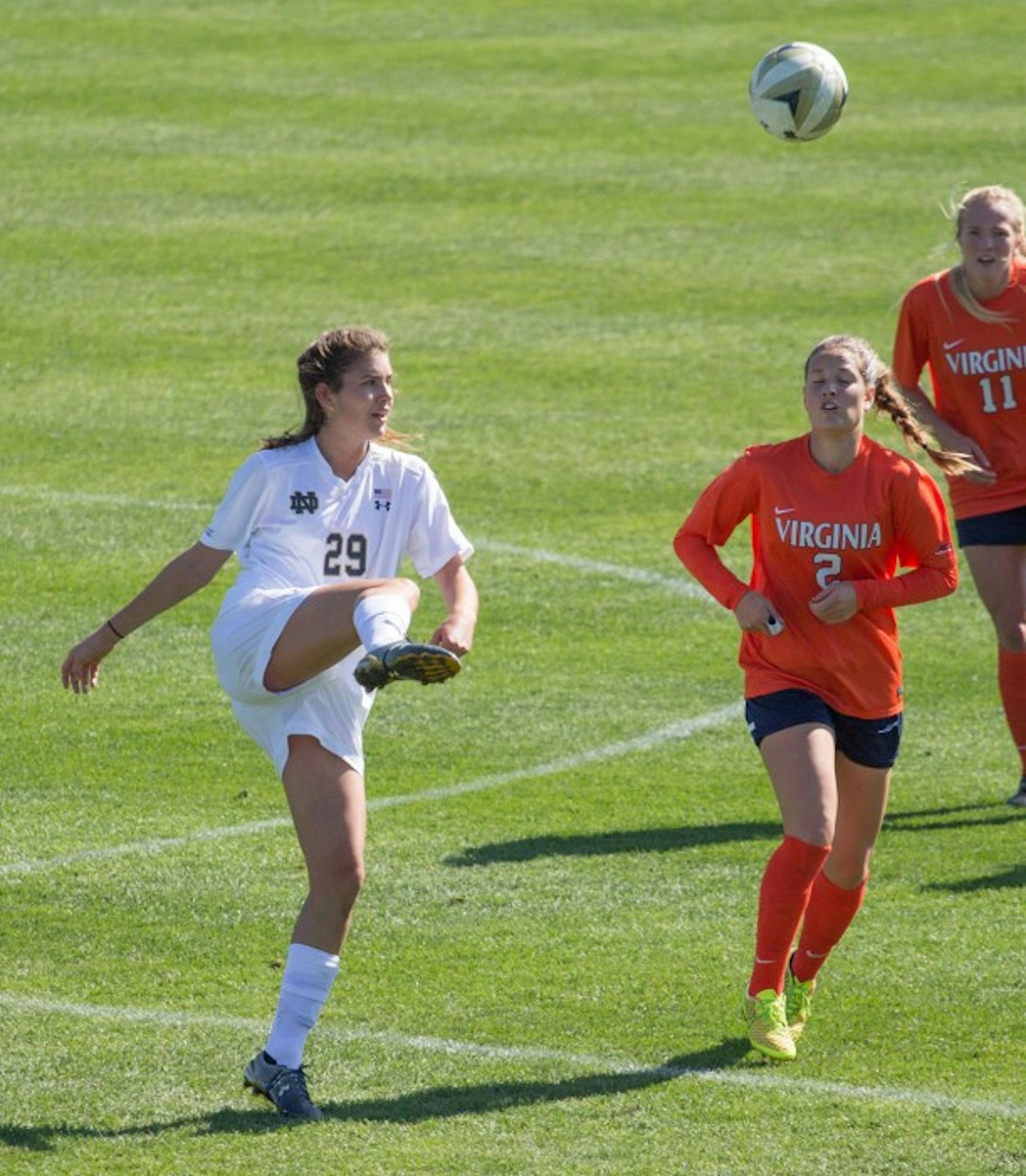 Irish junior Taylor Klawunder kicks the ball during Notre Dame’s 1-0 loss to Virginia on Sunday at Alumni Stadium. Klawunder has two goals and one assist on the season.