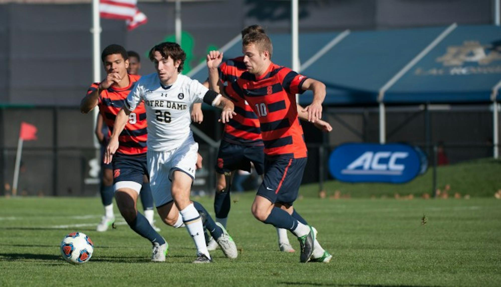 Junior midfielder Mark Gormley fend off defenders during Notre Dame’s 1-0 loss to Syracuse on Sunday in the ACC championship game at Alumni Stadium. Notre Dame starts NCAA tournament play this Sunday against Tulsa.