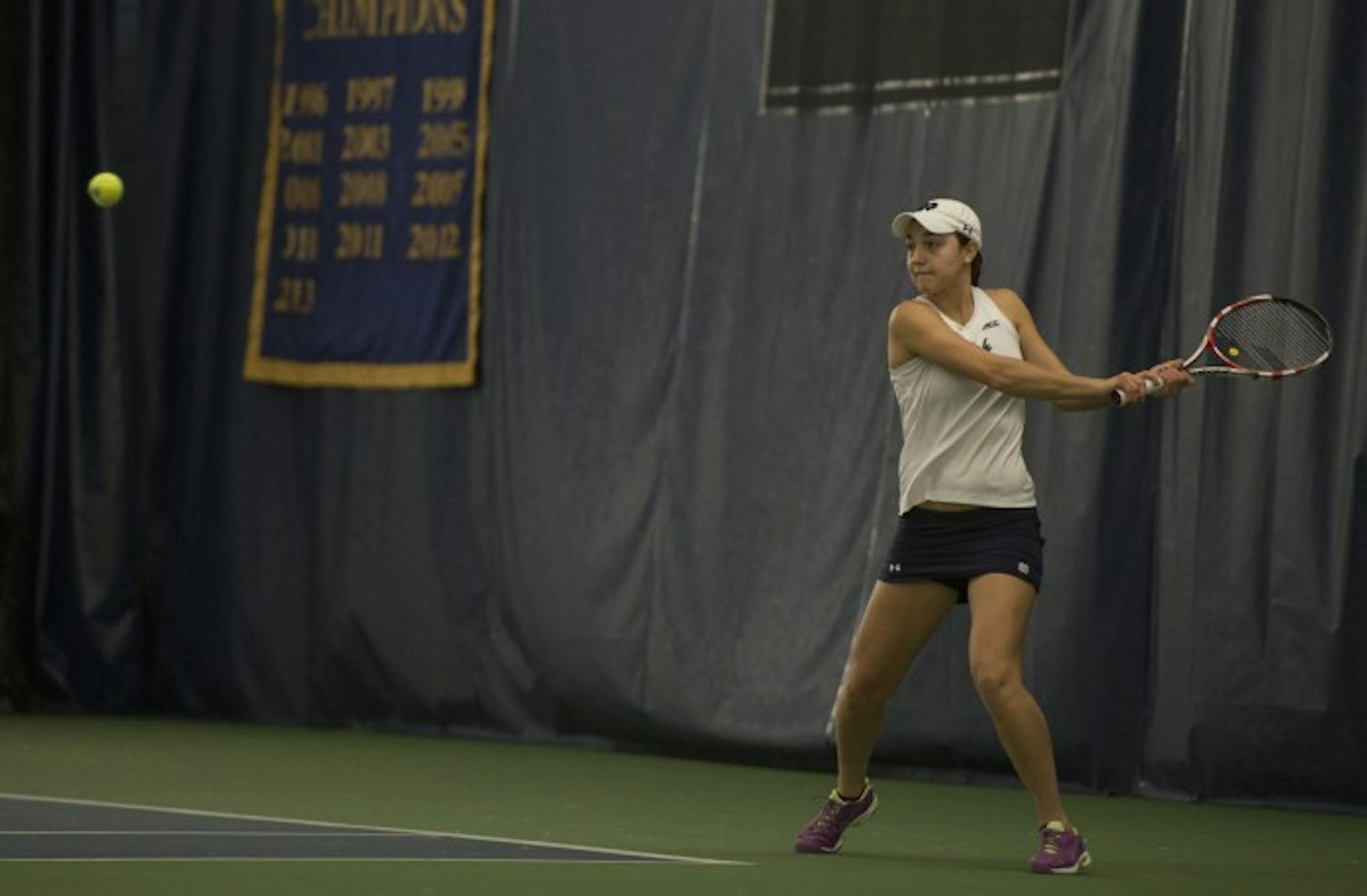 Senior Quinn Gleason prepares to hit a backhand during Notre Dame’s 6-1 loss to Stanford on Feb. 6 at Eck Family Tennis Pavilion. Gleason won all three of her signles matches this weekend.
