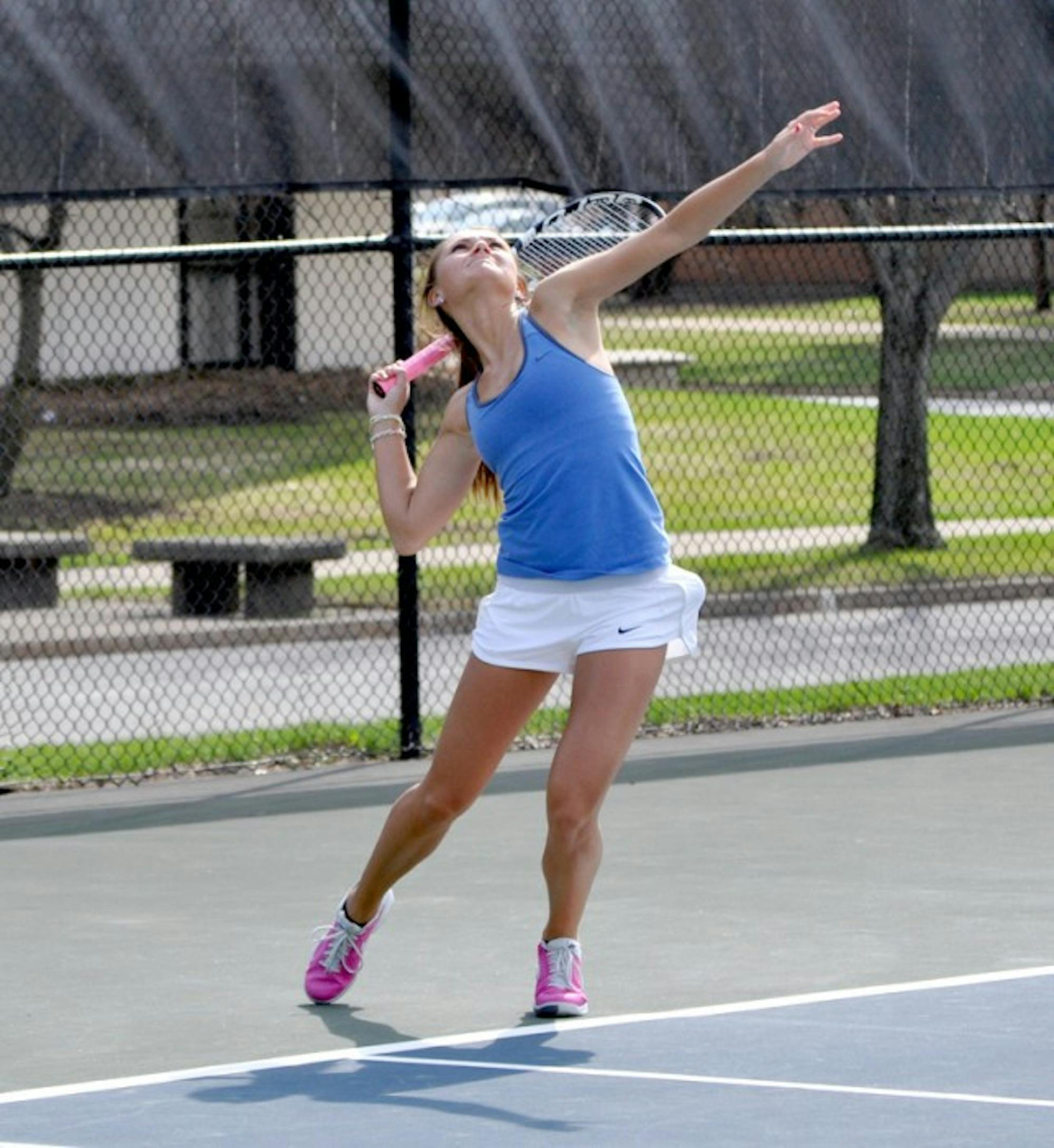 Saint Mary's junior Kayle Sexton unleashes a serve during the Belles' 8-1 loss to Hope on April 17.