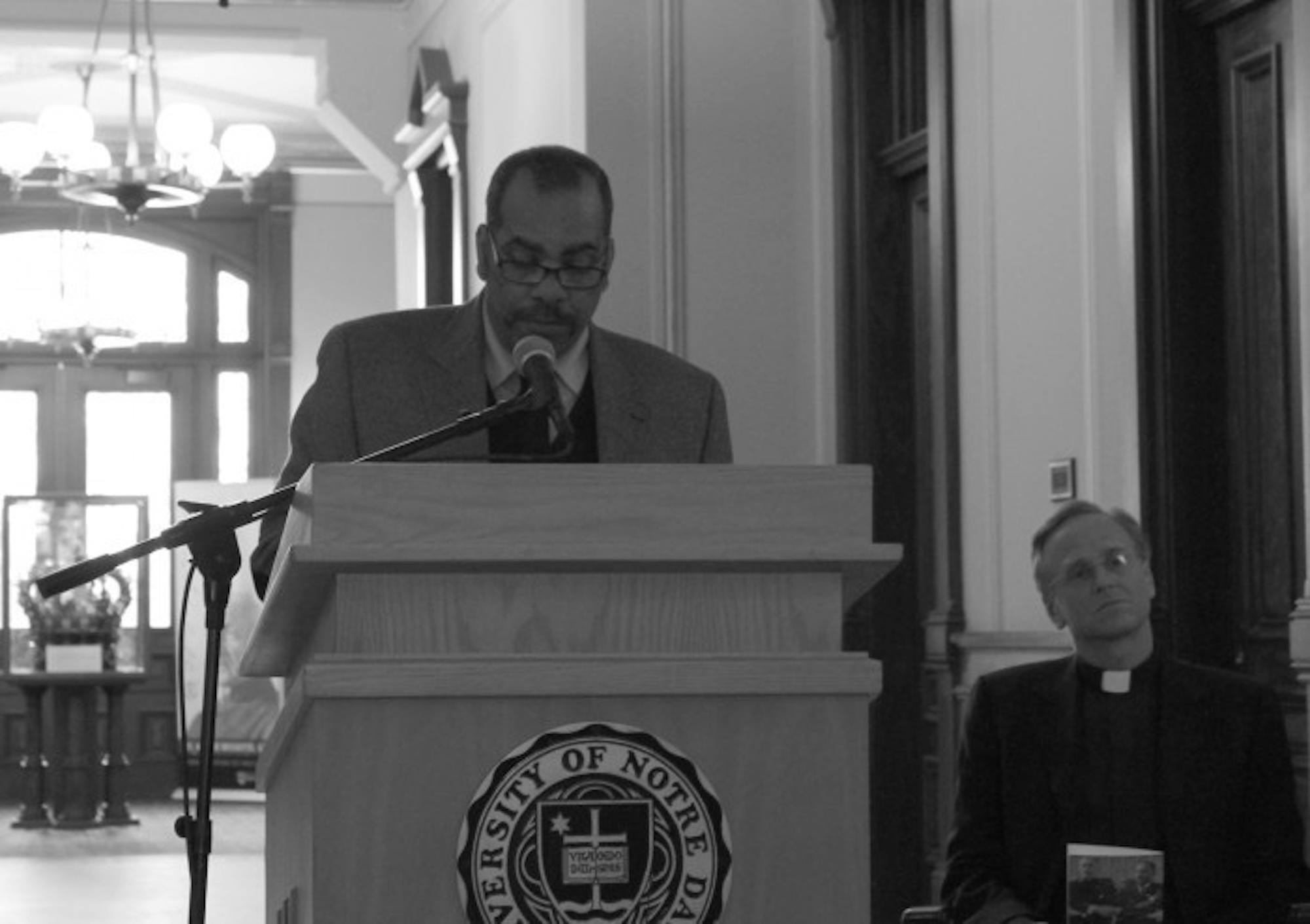 Dean of the First Year of Studies Hugh Page reads an excerpt from Martin Luther King, Jr.’s sermon   “Loving Our Enemies” at a prayer service Monday in the rotunda of Main Building.