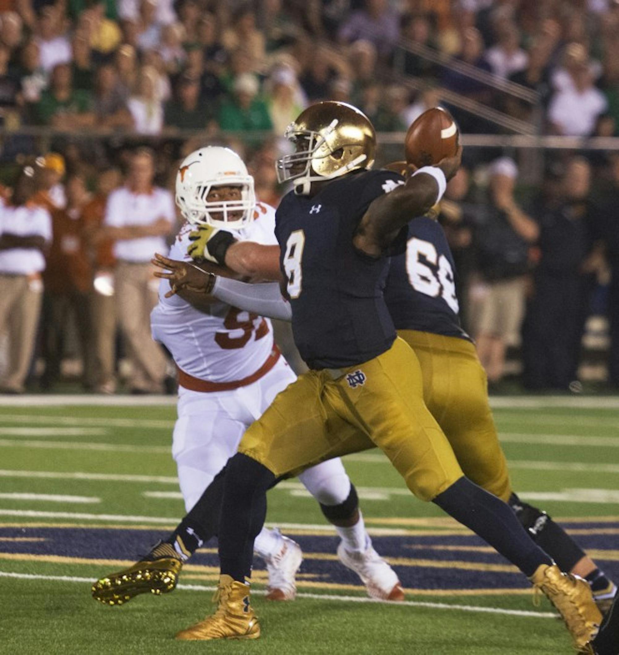 Senior quarterback Malik Zaire winds up for a pass during Notre Dame’s 38-3 win over Texas on Sept. 12.
