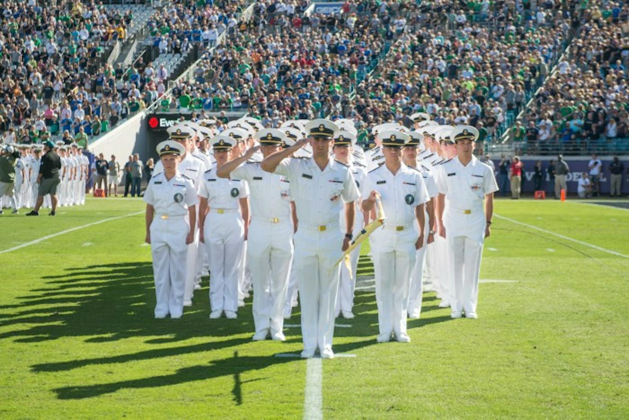 Midshipmen of Hotel Company participate in the opening procession of student attendees to the game.