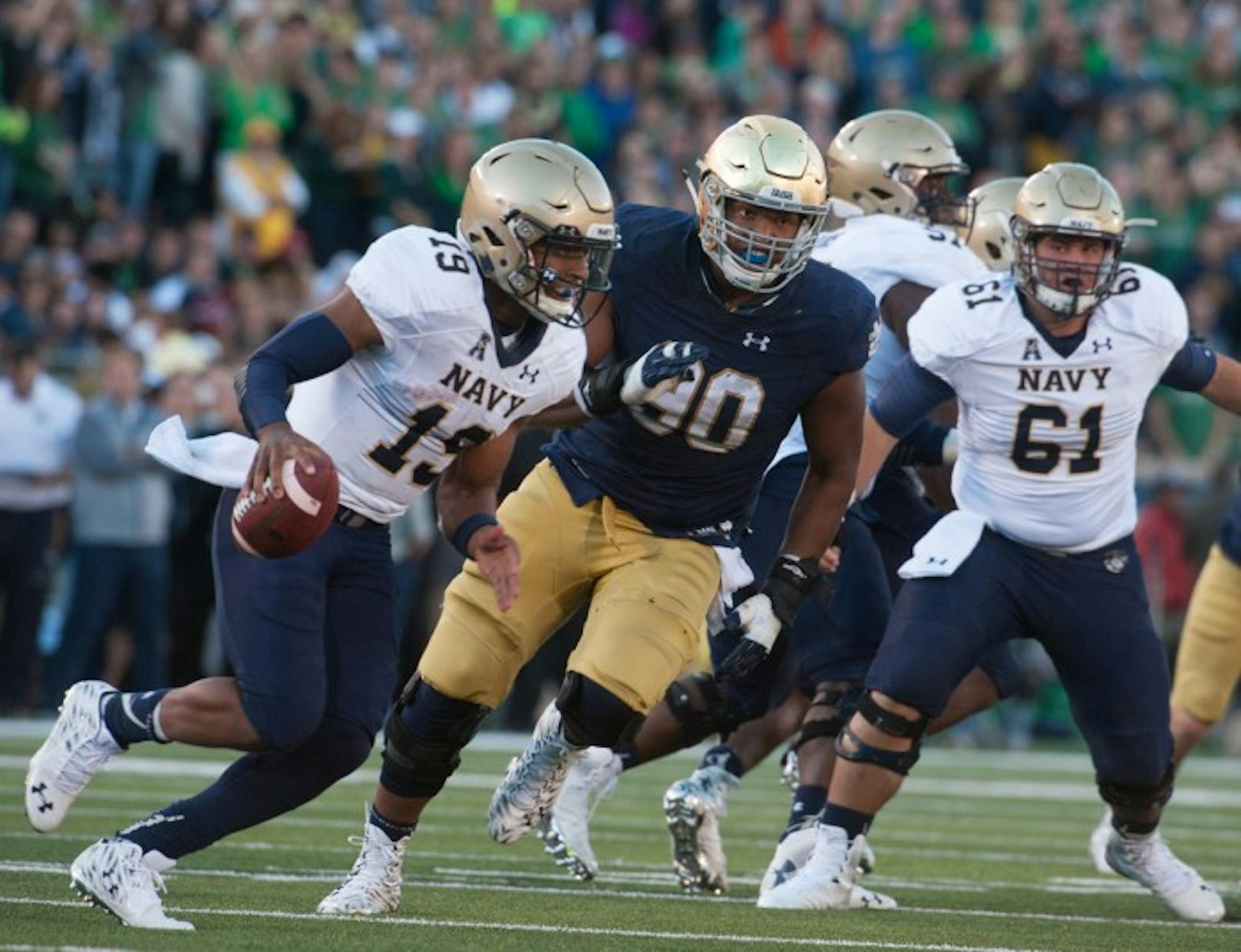 Irish senior defensive lineman Isaac Rochell chases after Navy senior quarterback Keenan Reynolds. Rochell recorded six tackles on the day, including one for a loss.