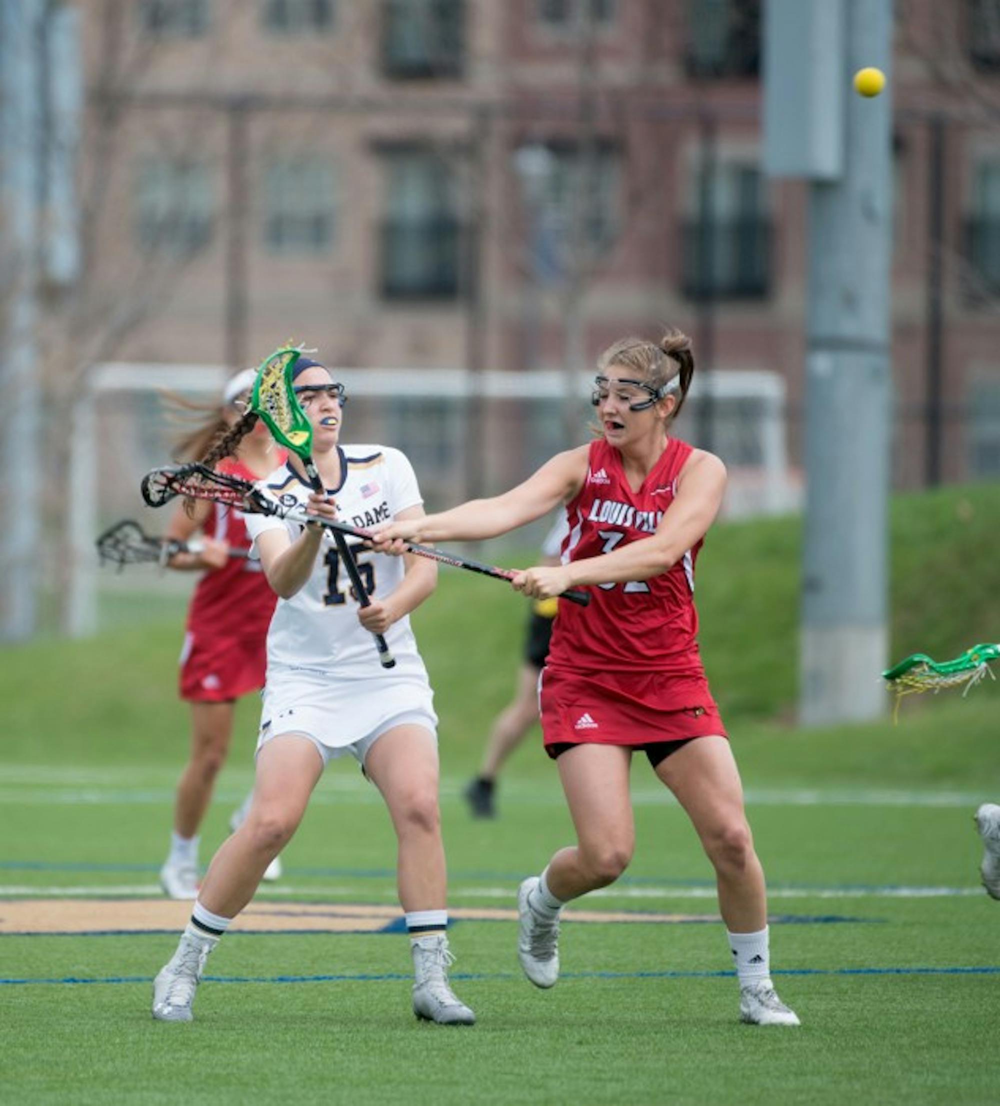 Irish sophomore attack Cortney Fortunato is pressured while passing during a 10-8 loss to Louisville at Arlotta Stadium on April 19.