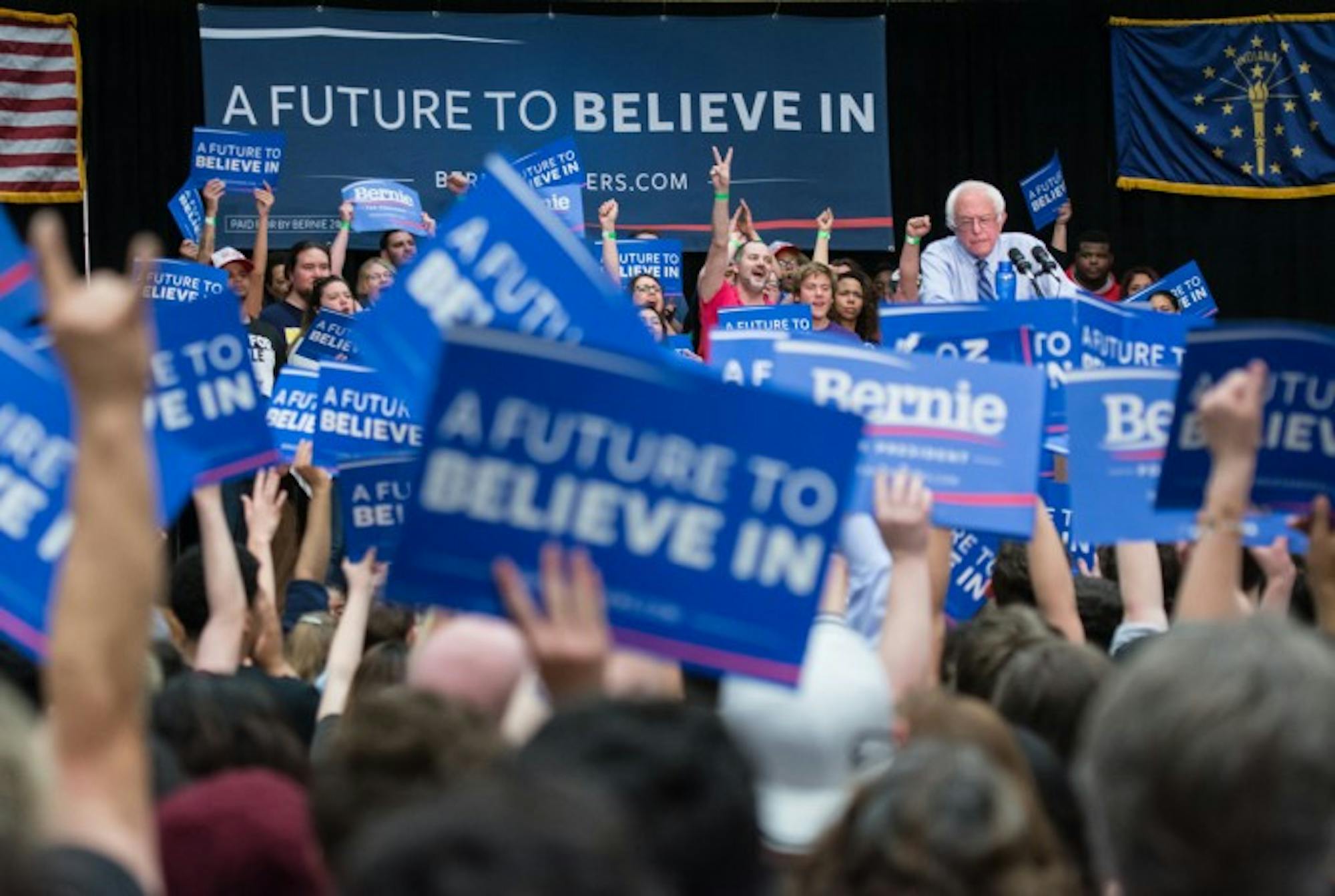 Supporters wave signs for Bernie Sanders at his rally Sunday. More than 4,000 people attended the event at the Century Center in South Bend.