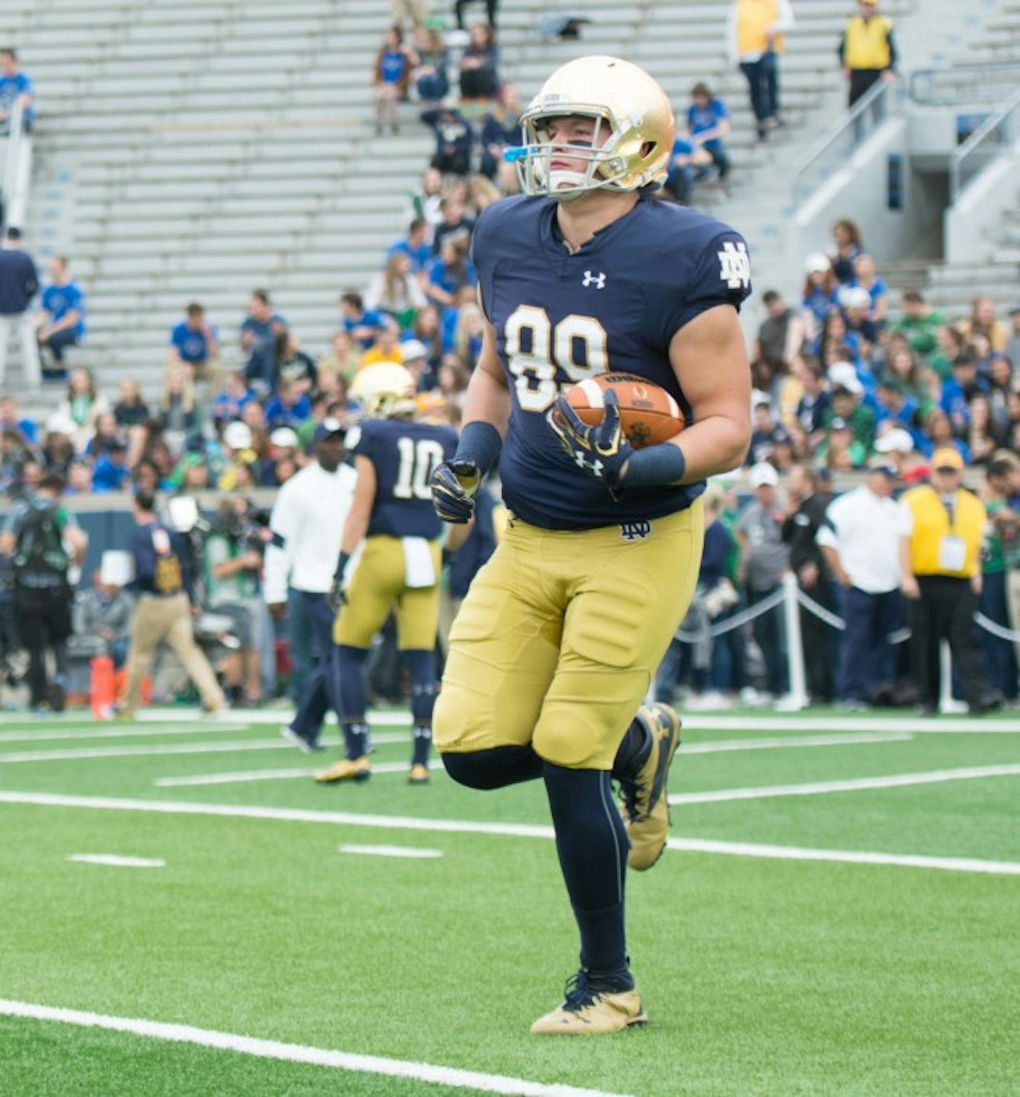Irish senior tight end Jacob Matuska catches a ball during warm ups before Notre Dame’s victory over Miami at Notre Dame Stadium.