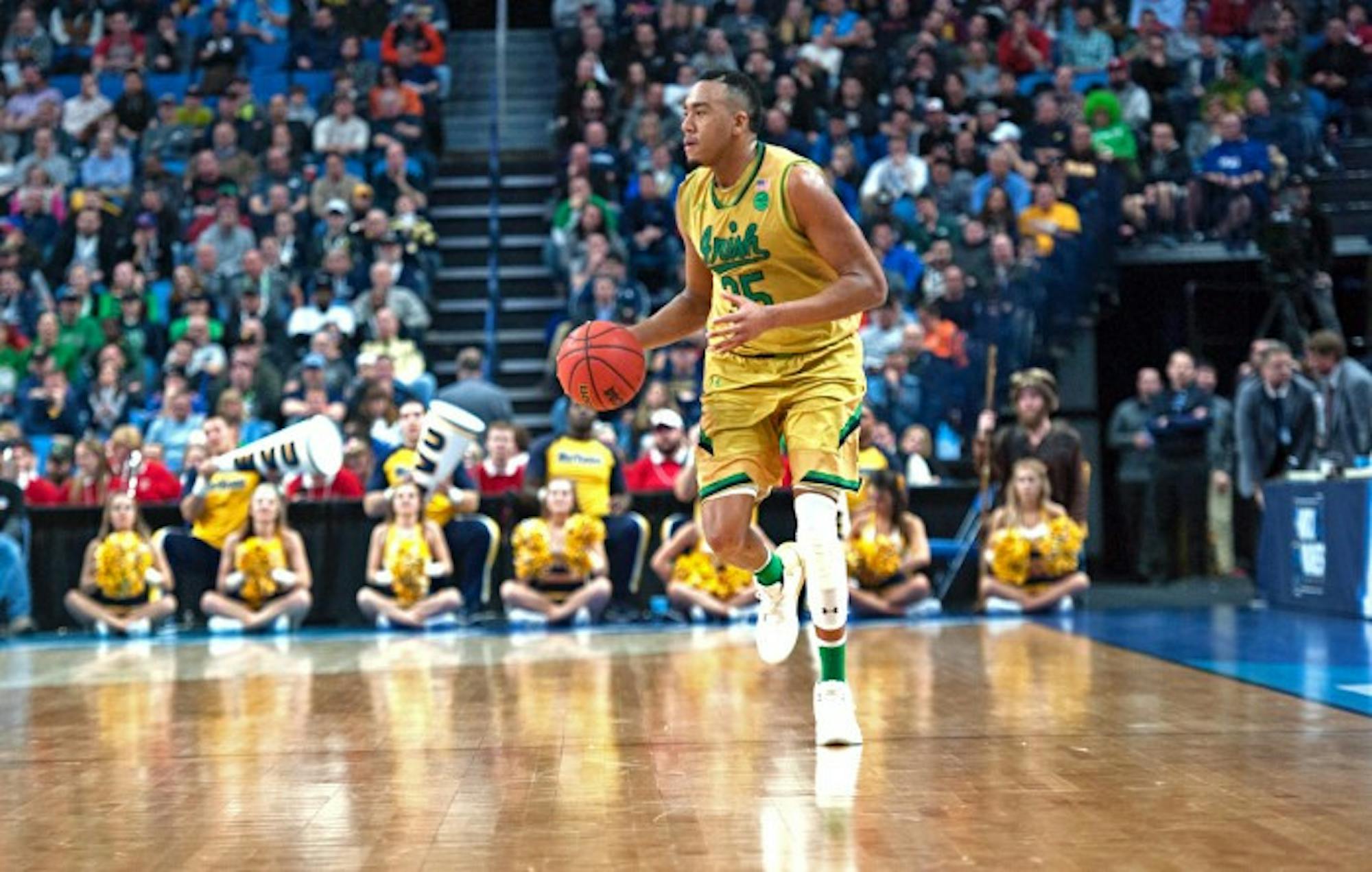 Irish junior forward Bonzie Colson dribbles down the court during Notre Dame’s 83-71 loss to West Virginia on March 18.