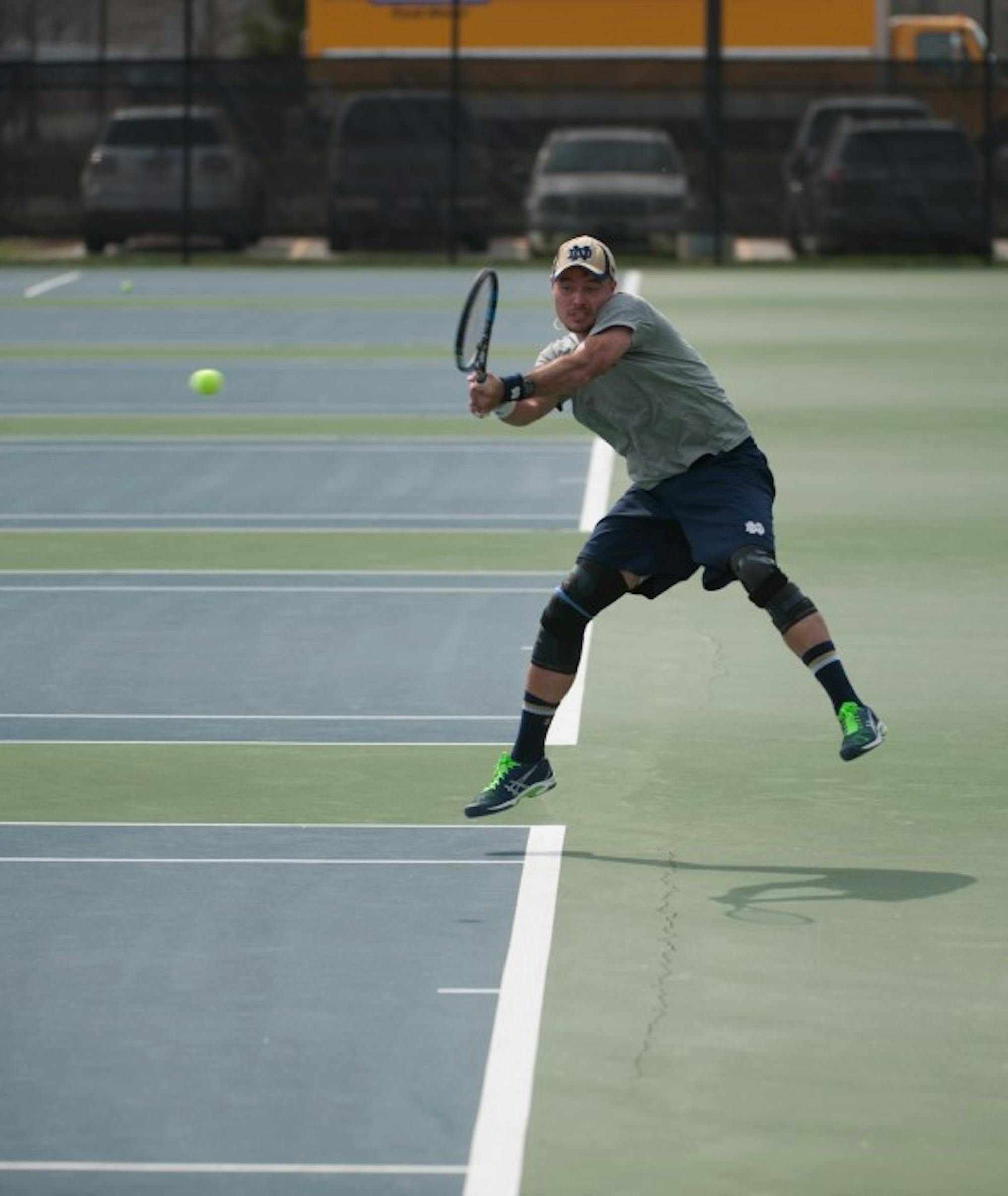 Senior Billy Pecor hits a backhand during Notre Dame’s 4-3 victory against North Carolina State on April 18 at Courtney Tennis Center.