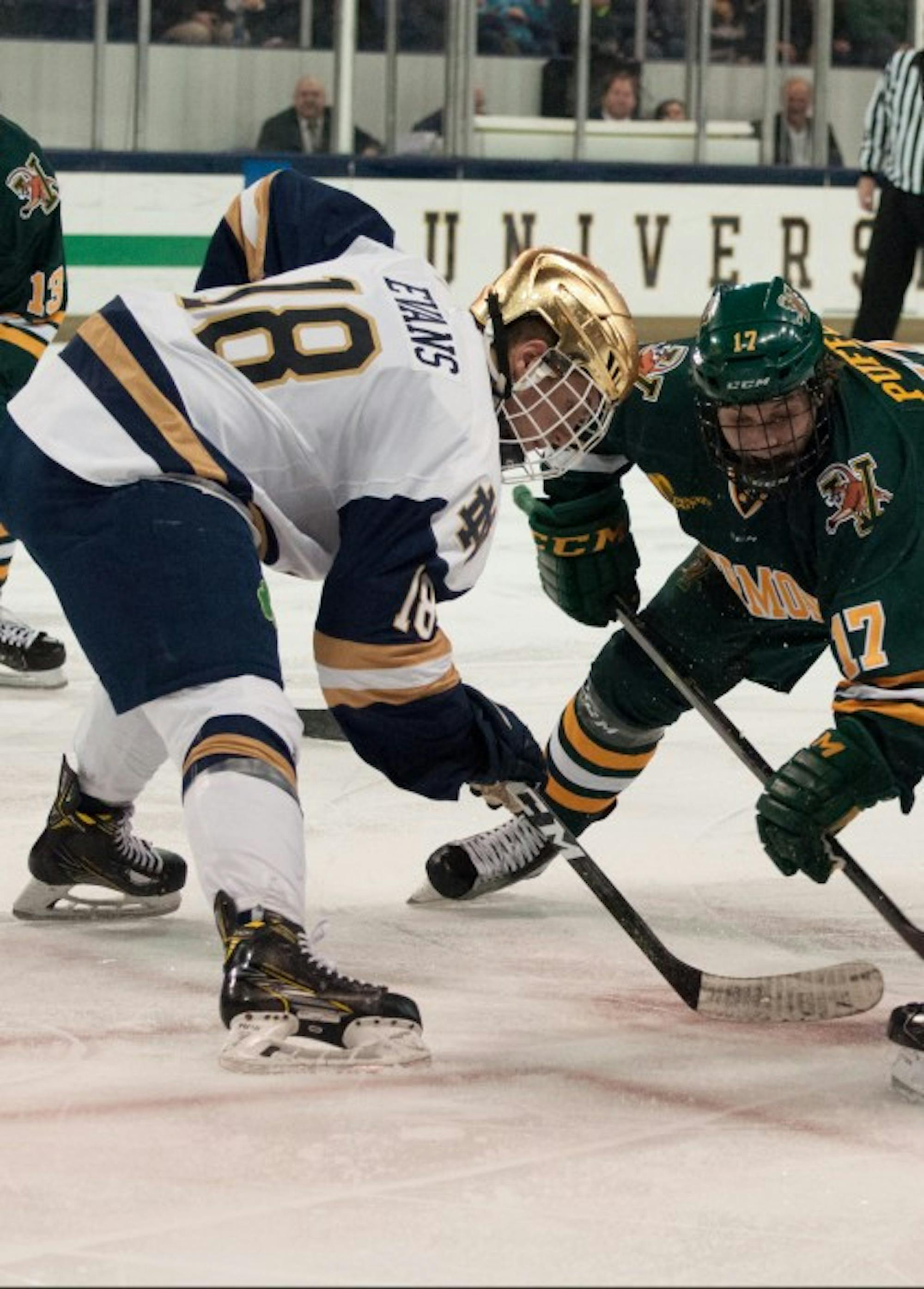 Irish junior forward Jake Evans squares up for a faceoff during Notre Dame's 4-4 tie with Vermont on Feb. 3 at Compton Family Ice Arena.