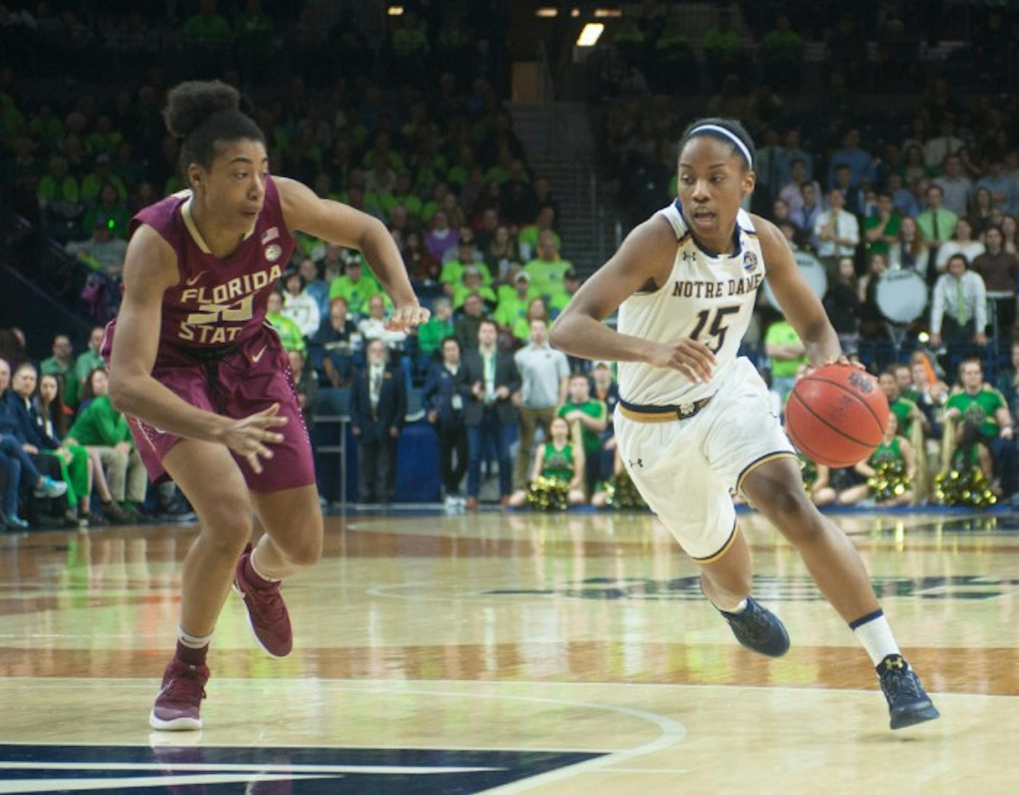 Irish senior guard Lindsay Allen dribbles past a defender during Notre Dame’s 79-61 win over Florida State on Feb. 26 at Purcell Pavilion.