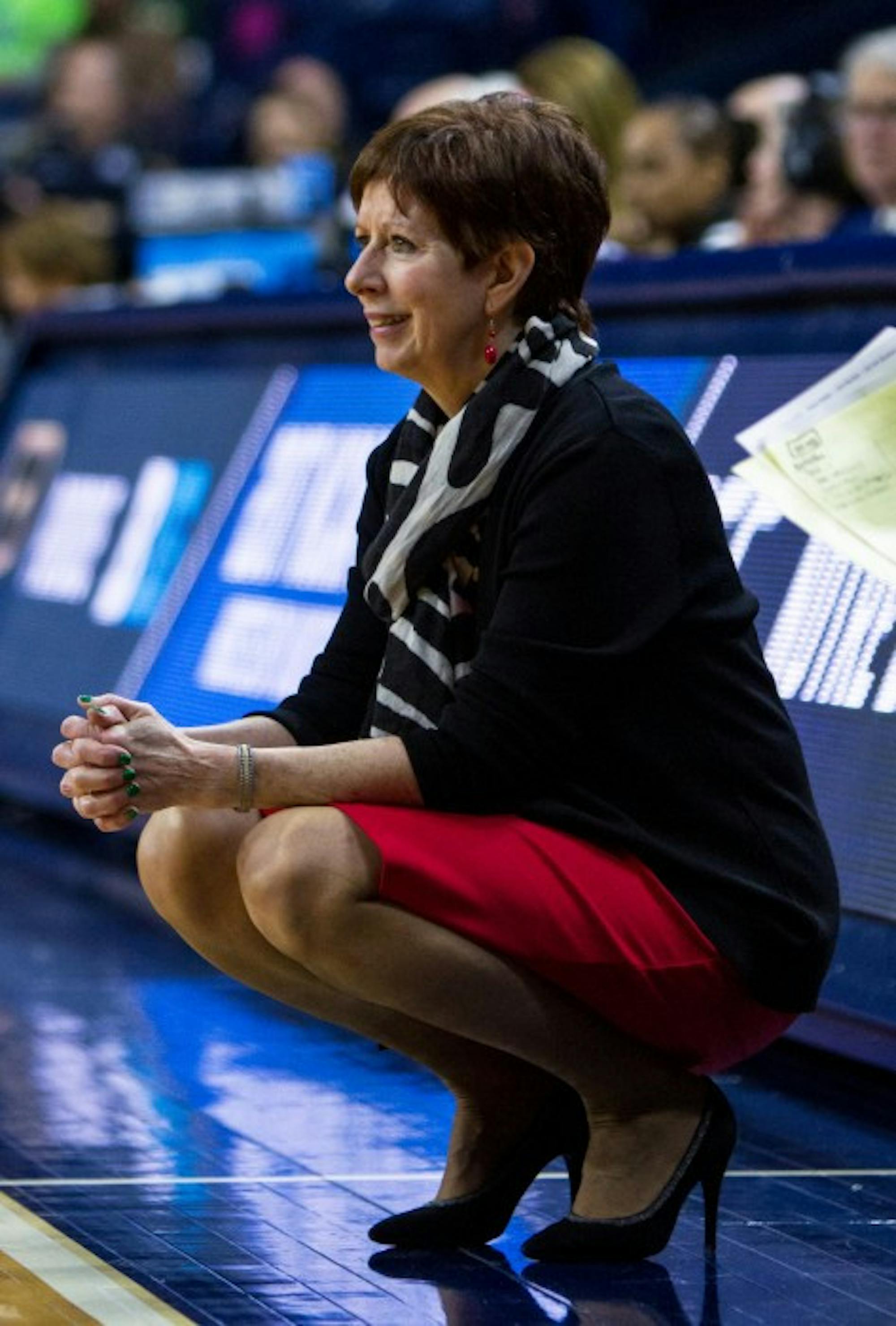 Irish head coach Muffet McGraw crouches during Notre Dame's 88-82 overtime victory over Purdue on March 19 at Purcell Pavilion