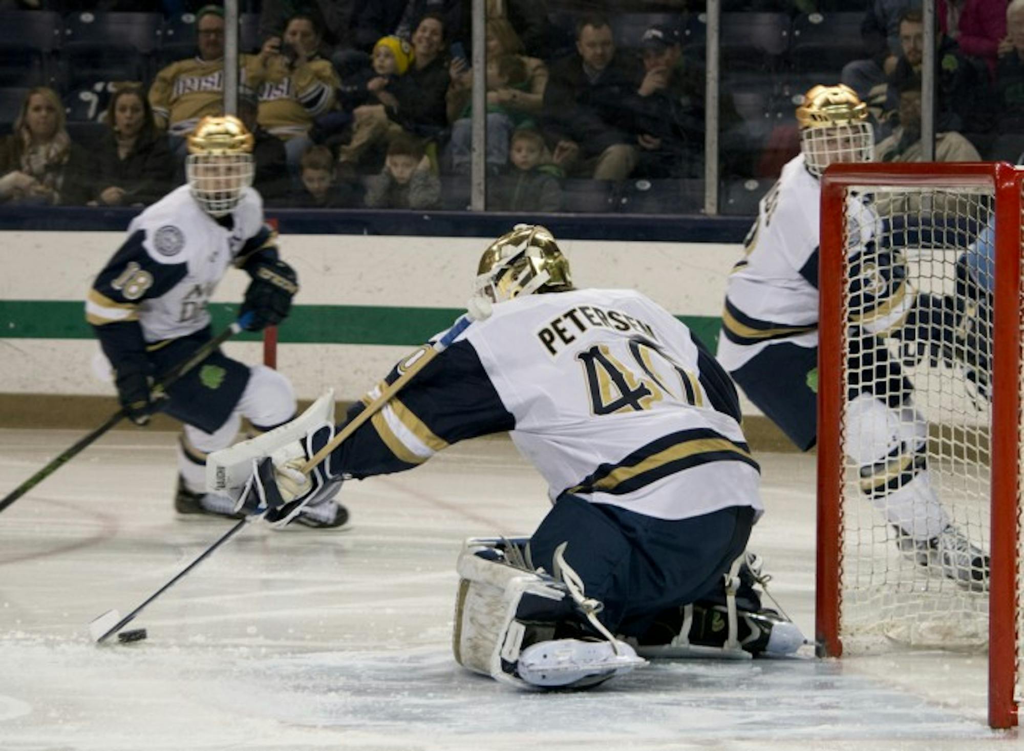 Irish sophomore goaltender Cal Petersen corrals a loose puck during Notre Dame’s 5-1 win over Maine on Saturday.