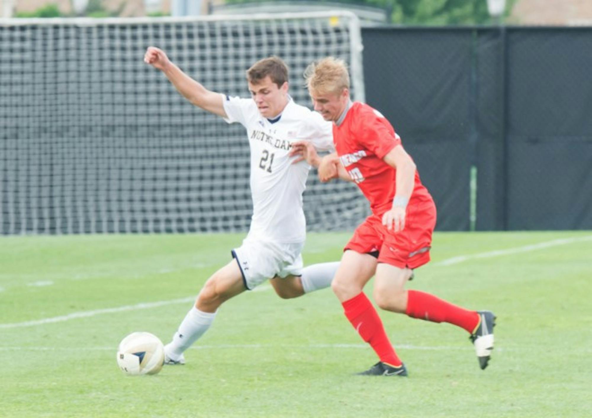 Irish sophomore midfielder Thomas Ueland attempts to dribble around a defender during Notre Dame’s 1-0 win over New Mexico.