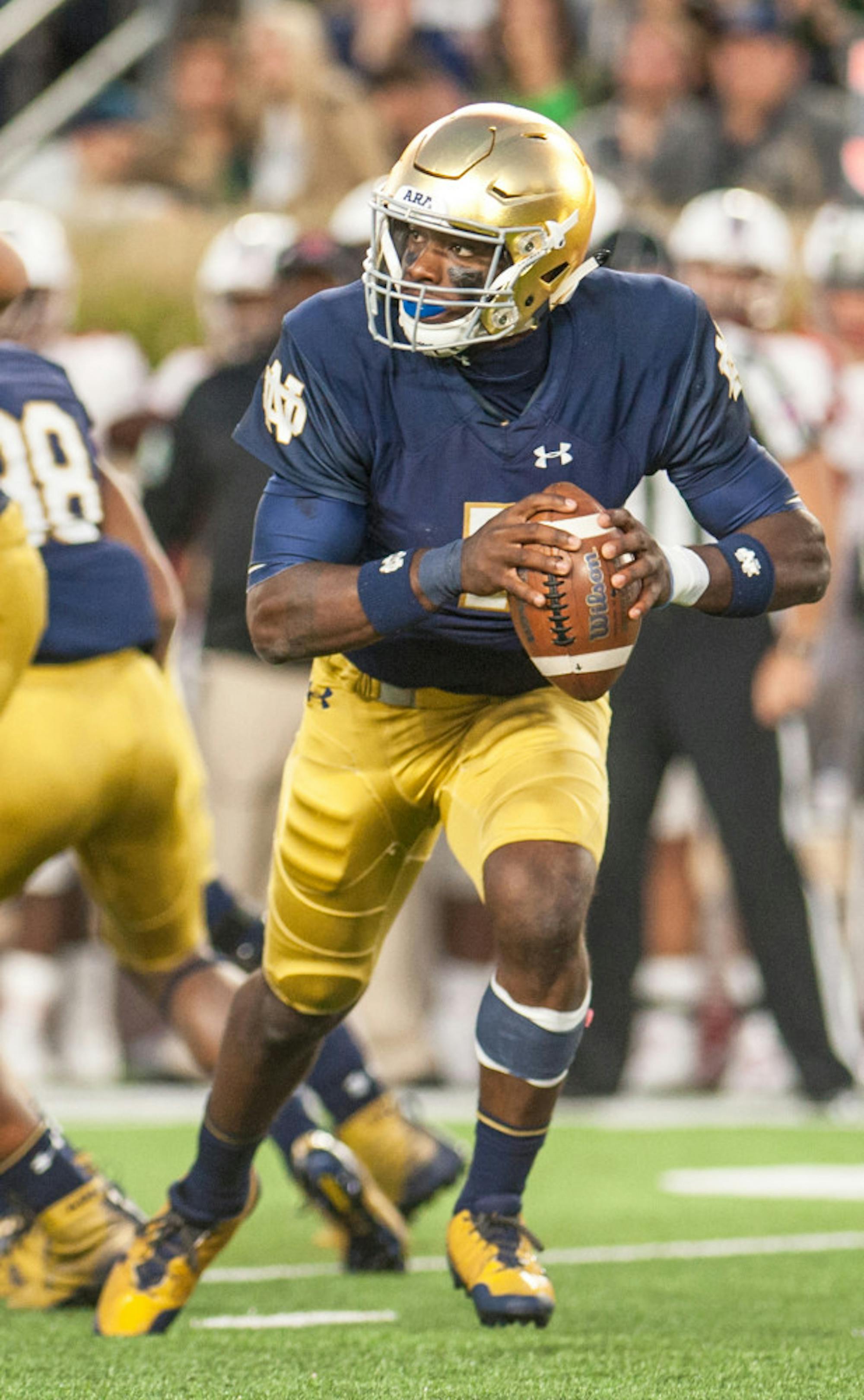 Irish junior quarterback Brandon Wimbush scrambles with the ball during Notre Dame's 52-17 win over Miami (OH) on Saturday at Notre Dame Stadium.