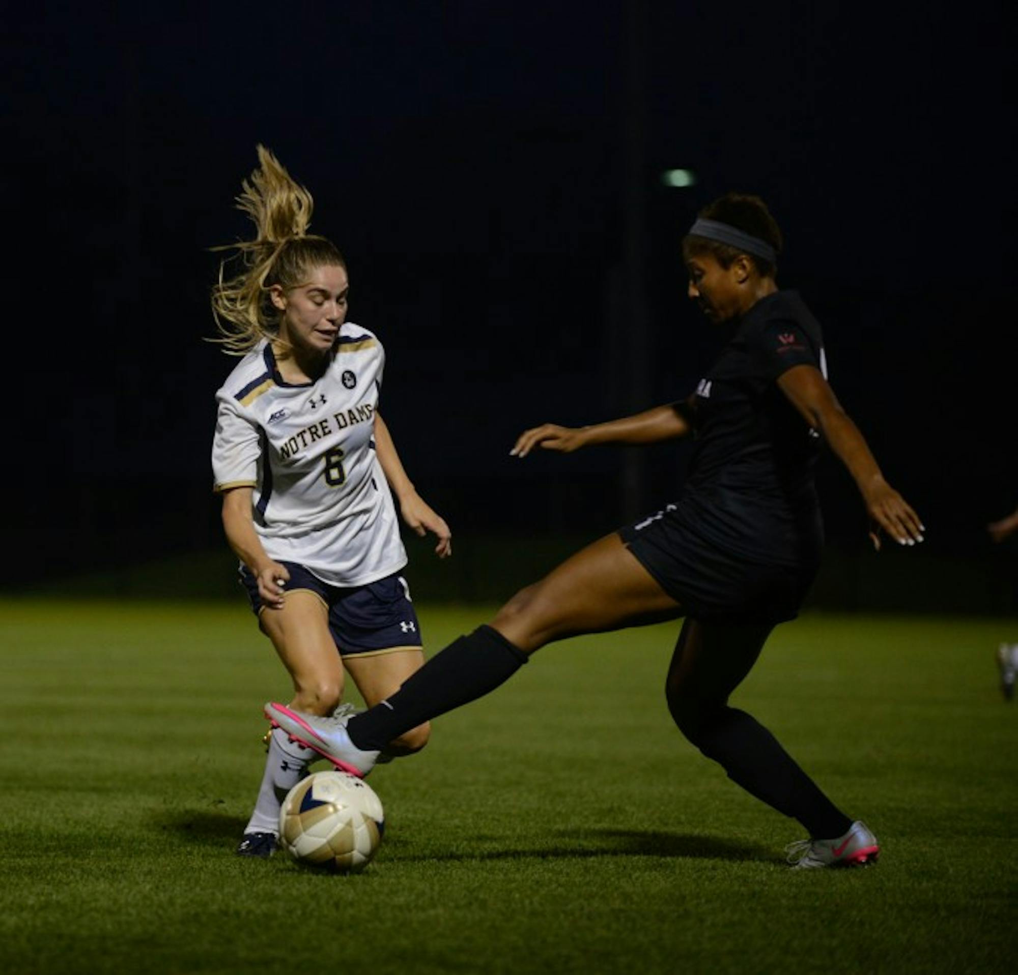 Irish senior forward Anna Maria Gilbertson attempts to dribble past a defender during Notre Dame’s 2-1 win over Santa Clara on Aug. 28.