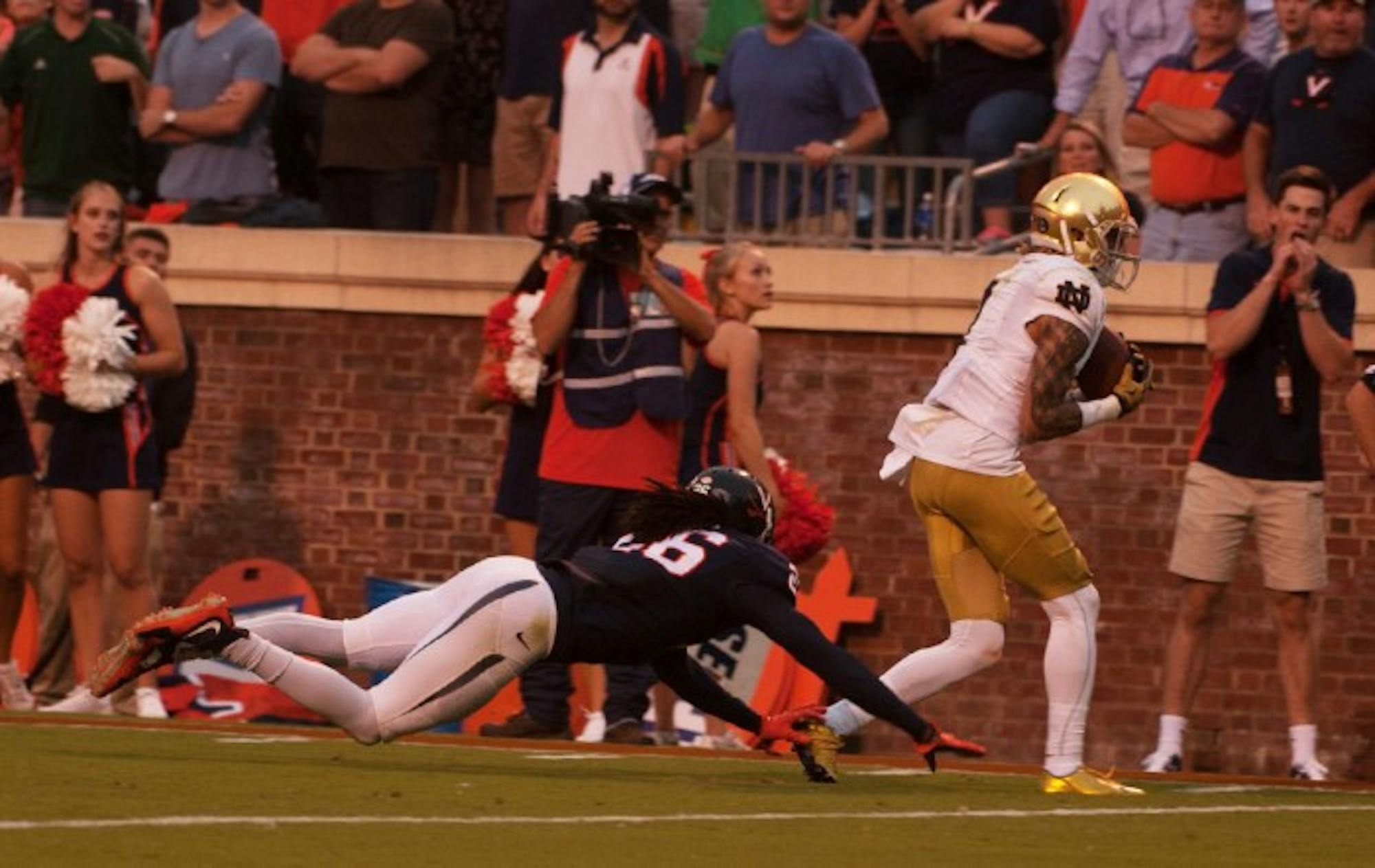 Irish junior receiver Will Fuller scores the game-winning touchdown in the final minute of Notre Dame’s 34-27, come-from-behind win at Virginia on Sept. 12 at Scott Stadium in Charlottesville, Virginia.