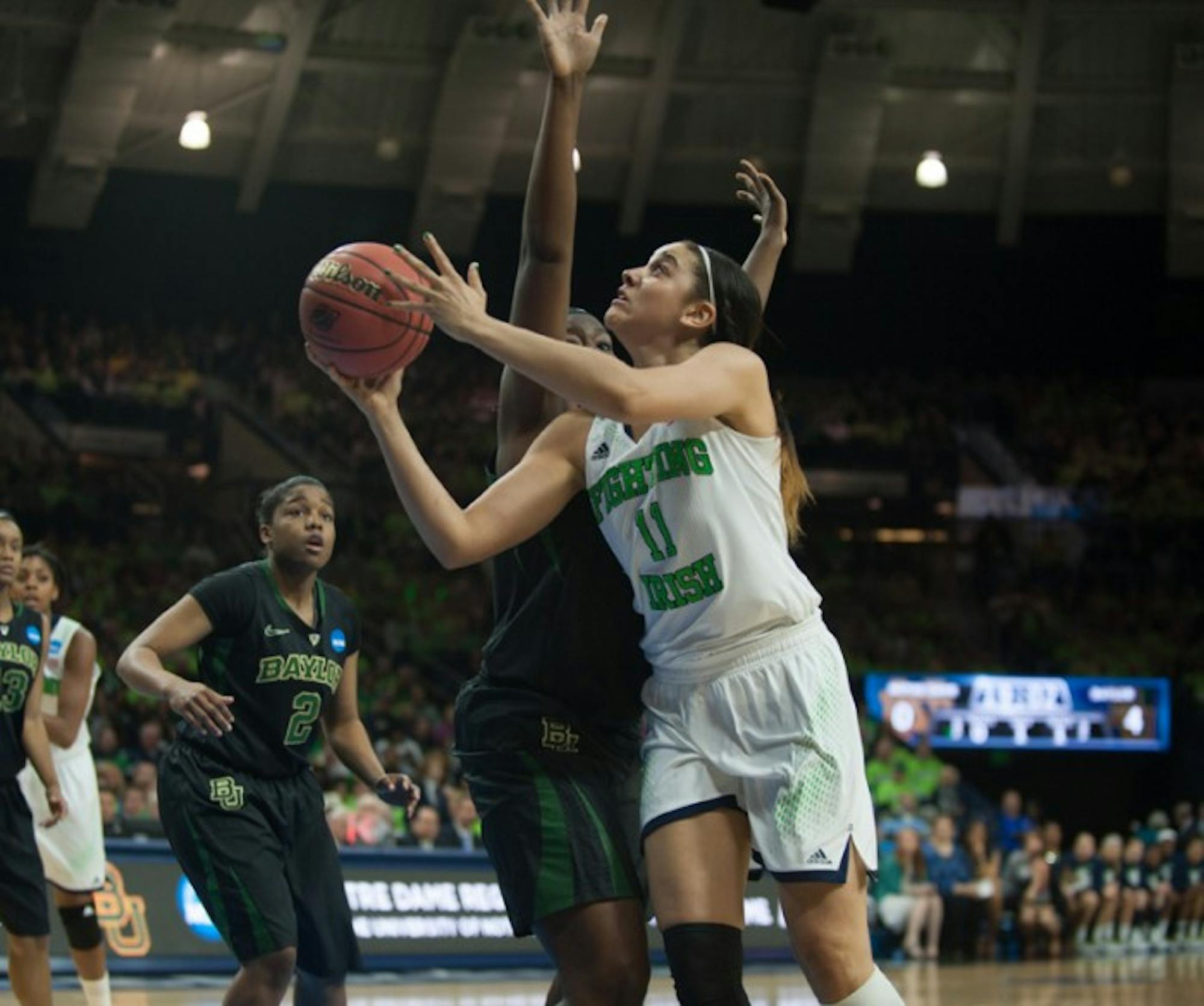 Irish senior forward Natalie Achonwa goes in for a layup during Notre Dame’s 88-69 victory over Baylor on Monday.  Achonwa tore her ACL in the second half of Monday’s contest.