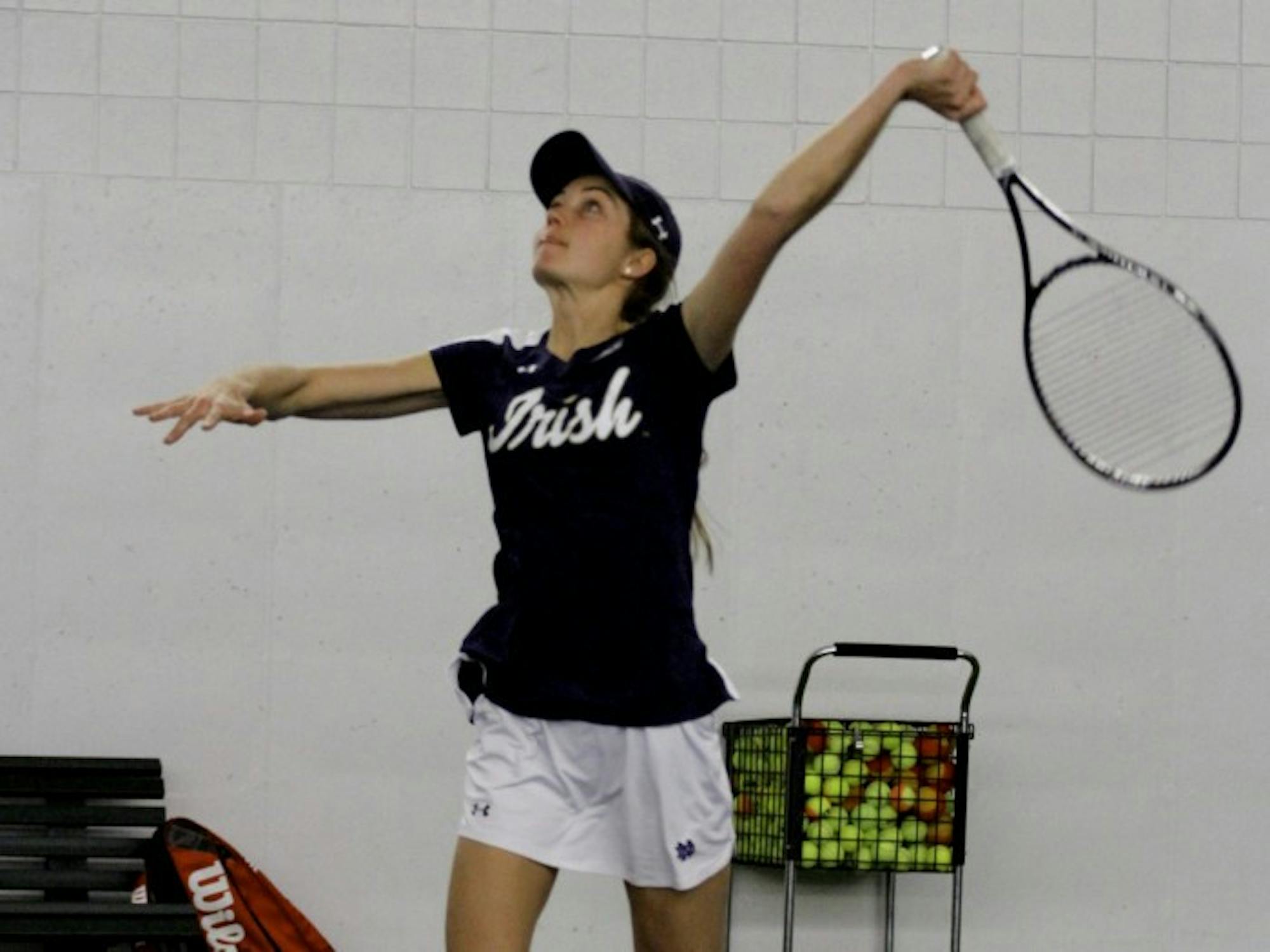 Irish senior Mary Closs serves the ball during Notre Dame’s 7-0 win over Western Michigan on Jan. 19, 2016, at Eck Tennis Pavilion.