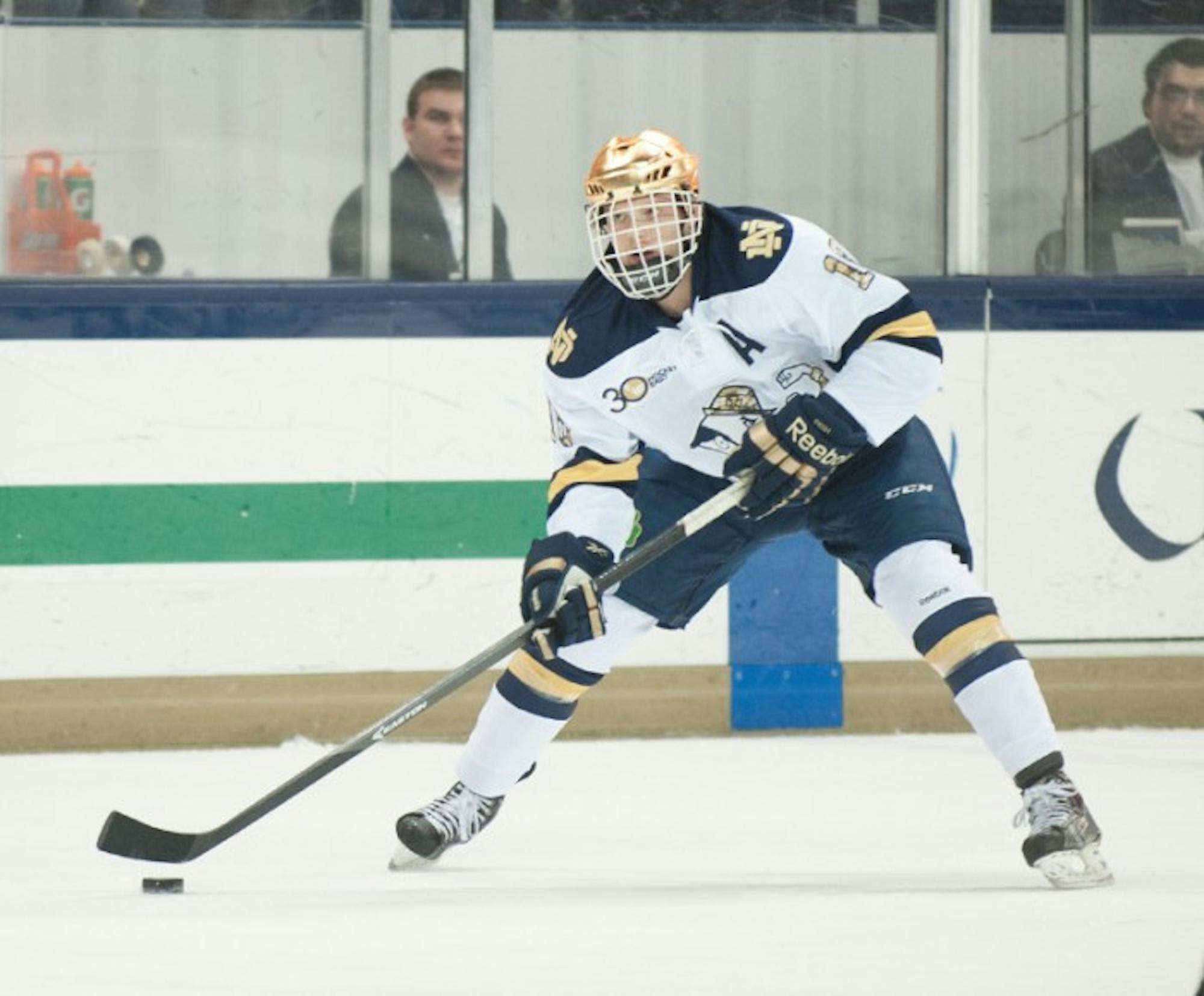 Senior center and alternate captain T.J. Tynan looks for an opening in Notre Dame’s 4-0 loss to Northeastern on Jan. 24.