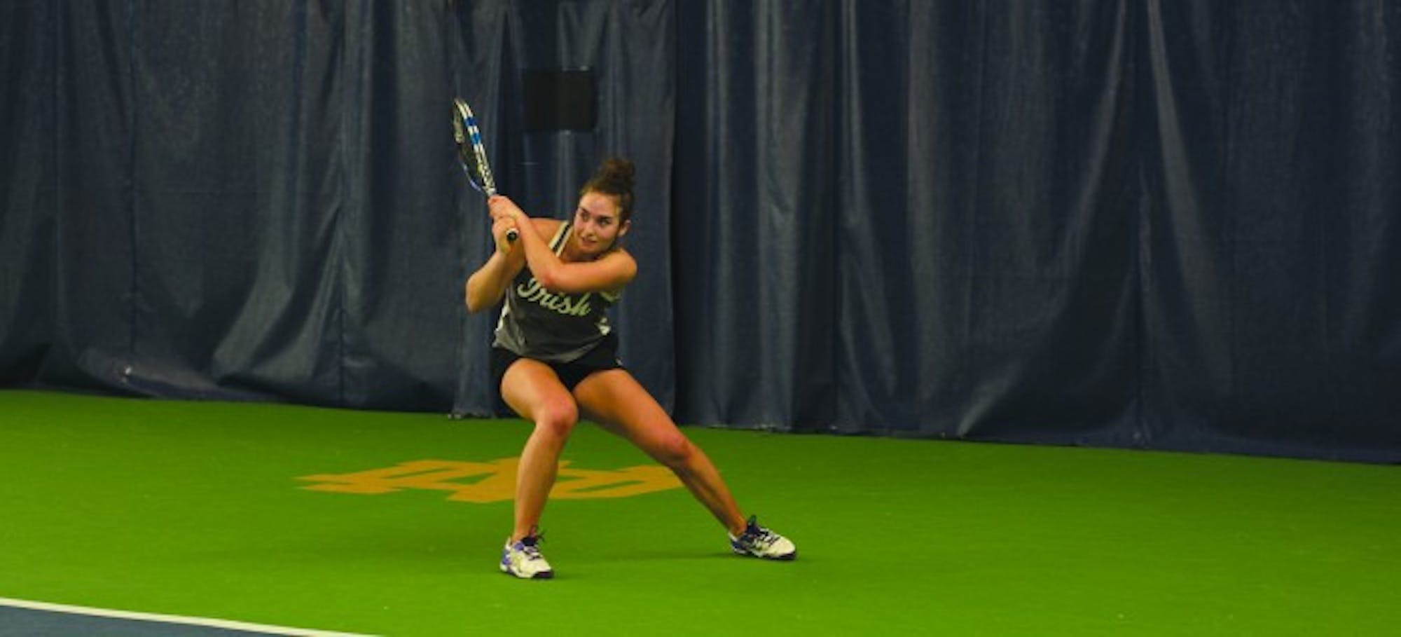 Irish senior Jane Fennelly returns her opponent’s shot during Notre Dame’s 6-1 win over Indiana on Feb. 20 at Eck Tennis Pavilion.
