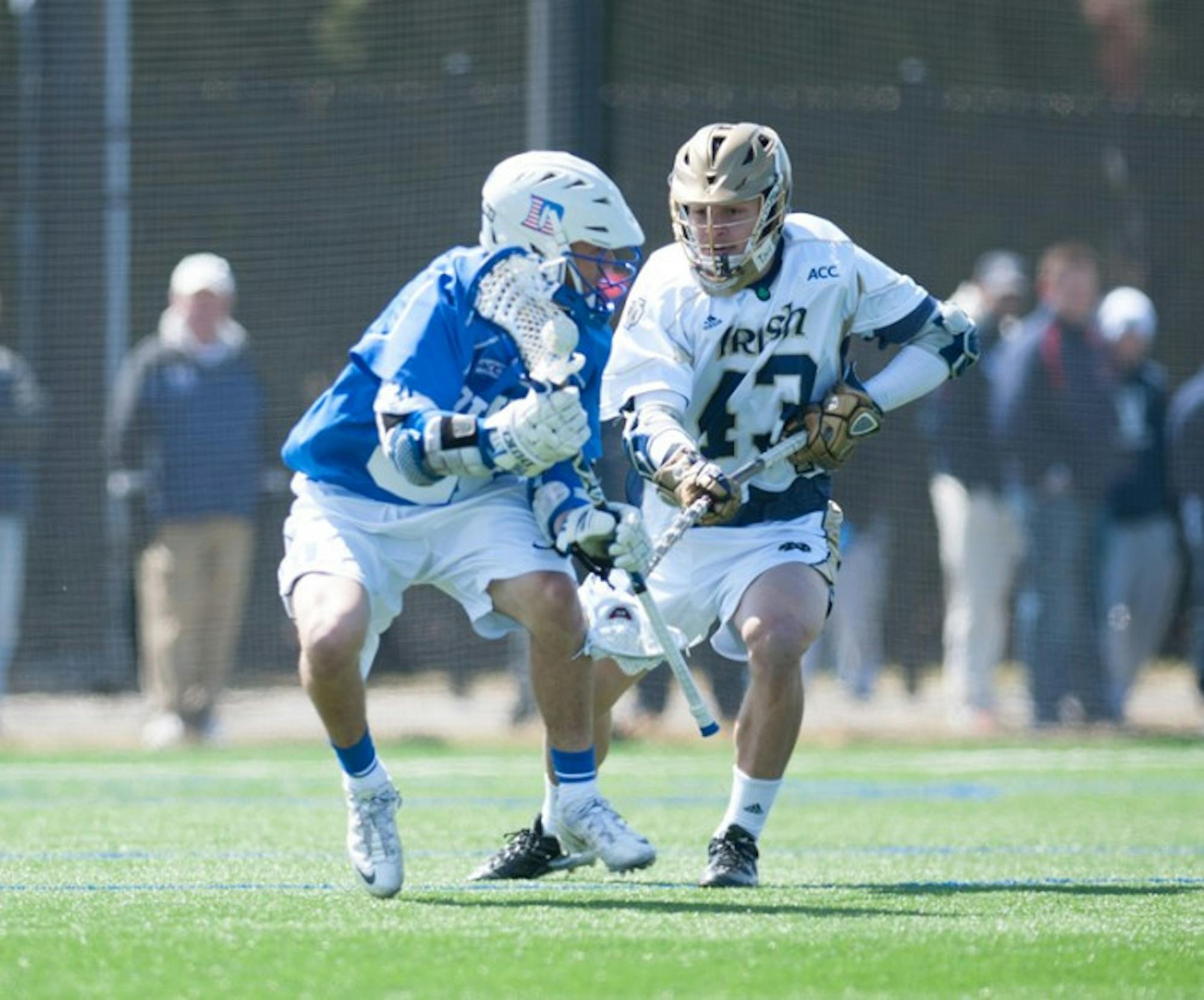 Irish sophomore midfield Matt Landis pursues a Duke ball-carrier during Notre Dame's 15-7 loss to the Blue Devils on April 5. Landis and the Notre Dame defense held Robert Morris to just five goals during a dominating 15-5 victory Saturday at Arlotta Stadium.