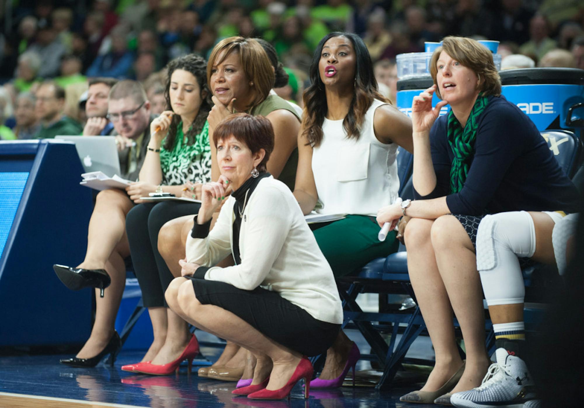 Muffet McGraw squats on the sideline as she watches her team defeat Montana 77-43 to advance to the second round of the NCAA tournament on March 20, 2015 at Purcell Pavilion.