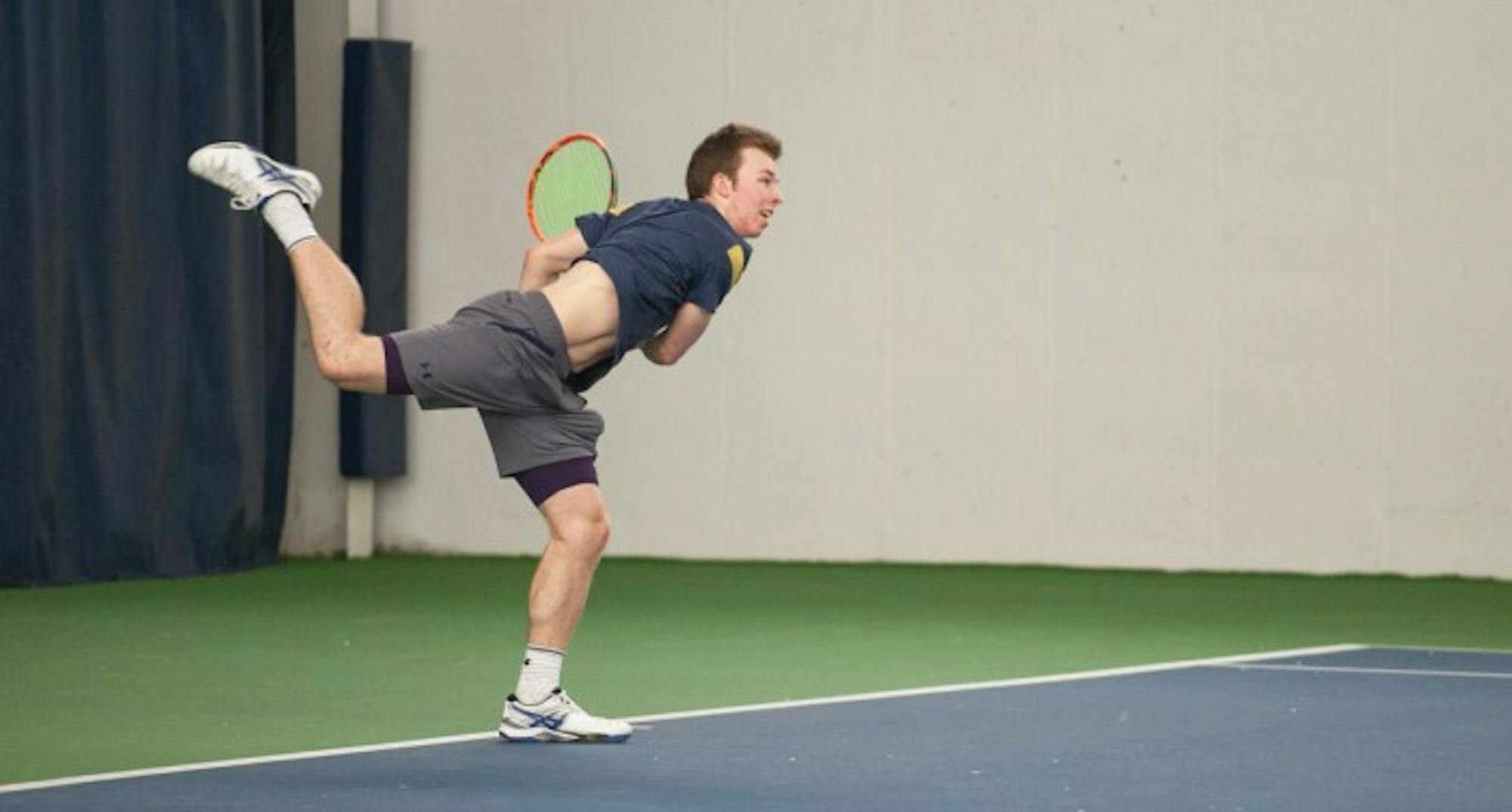 Irish freshman Matt Gamble serves the ball during Notre Dame’s 7-0 win over Boston College on  Feb. 11, at Eck Tennis Pavilion. Gamble lost in both of his singles matches this past weekend.