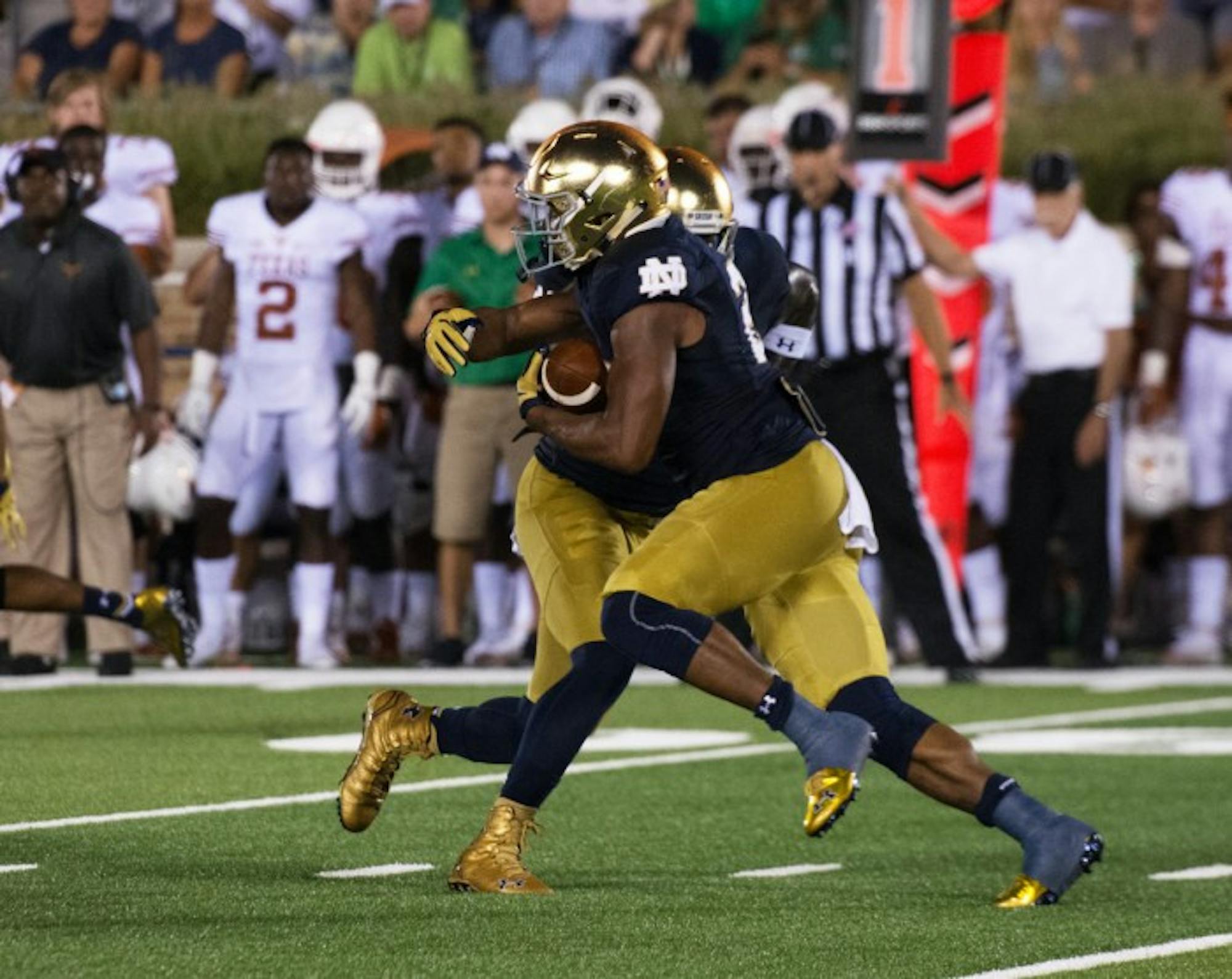 Irish senior running back Tarean Folston receives a handoff during Notre Dame’s 38-3 victory over Texas on Sept. 5 at Notre Dame Stadium. Folston is returning from a torn ACL suffered in last year's game against Texas.