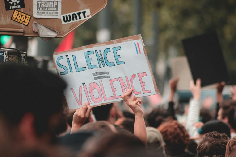 Protest sign shown on sexual violence.jpg