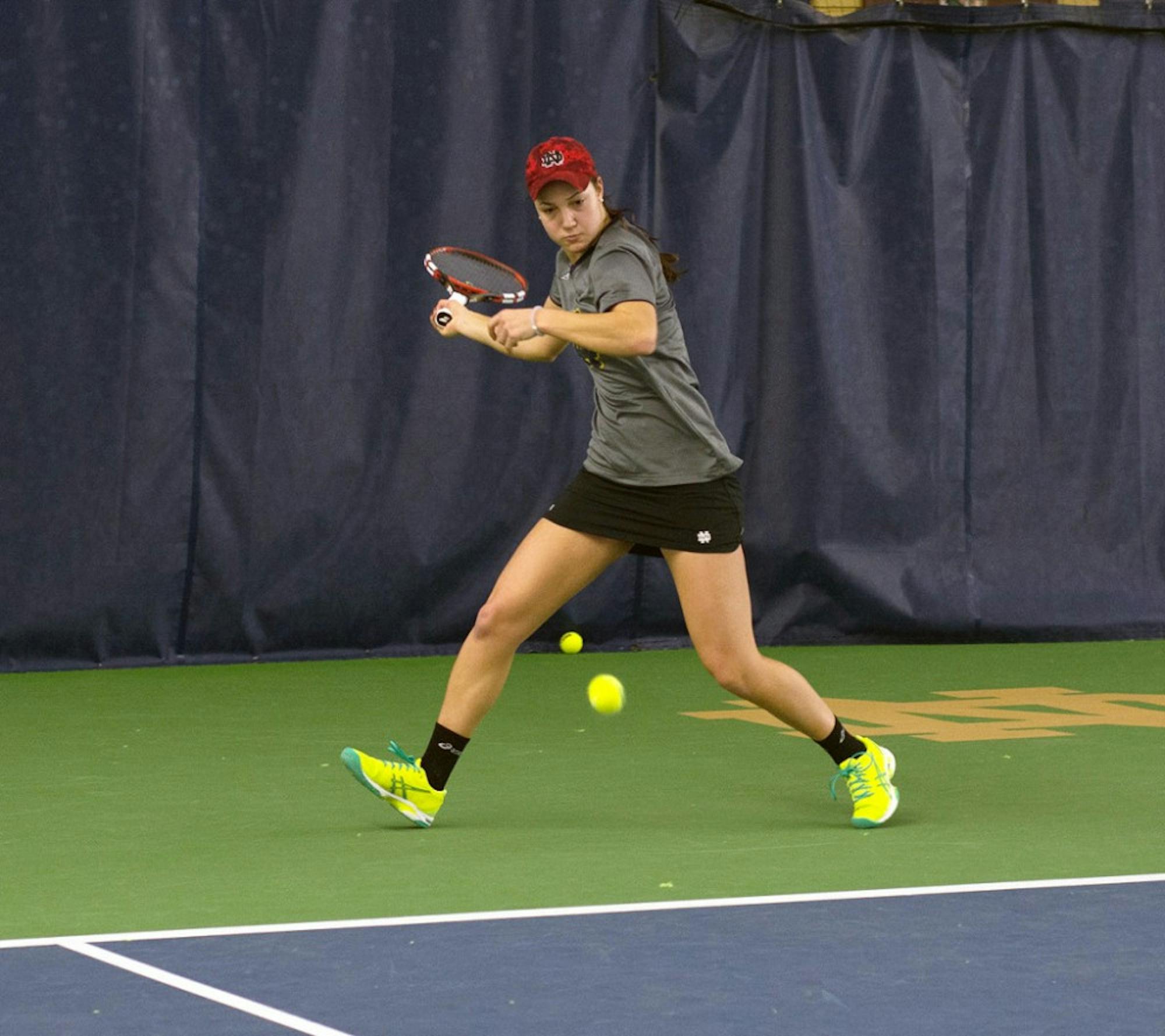 Irish senior Quinn Gleason prepares to hit a forehand during Notre Dame’s 6-1 victory over Indiana at Eck Tennis Pavilion on Feb. 20. Gleason held a 20-12 record, the second best on the Irish squad.