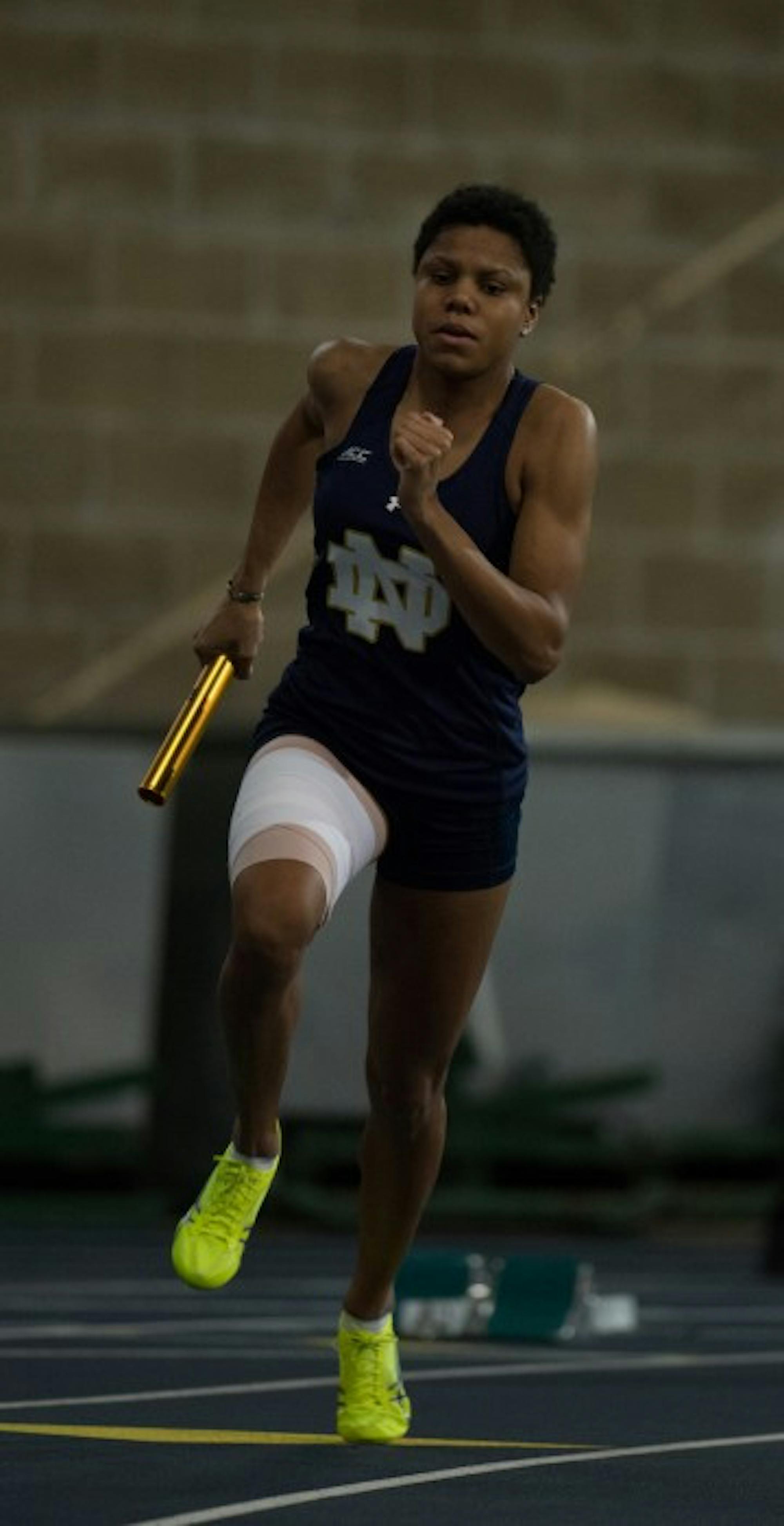 Irish freshman Parker English carries the baton in the 4x400-meter relay during the Meyo Invitational on January 24 at Loftus Sports Center.