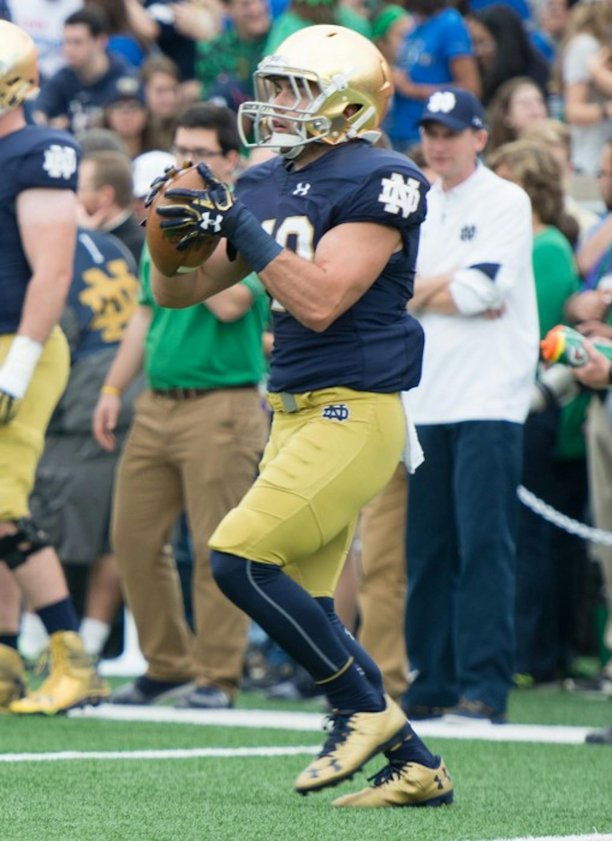 Irish senior running back Bailey Ross warms up before Notre Dame’s game against Miami. Ross is a walk-on along with his brother, Austin.