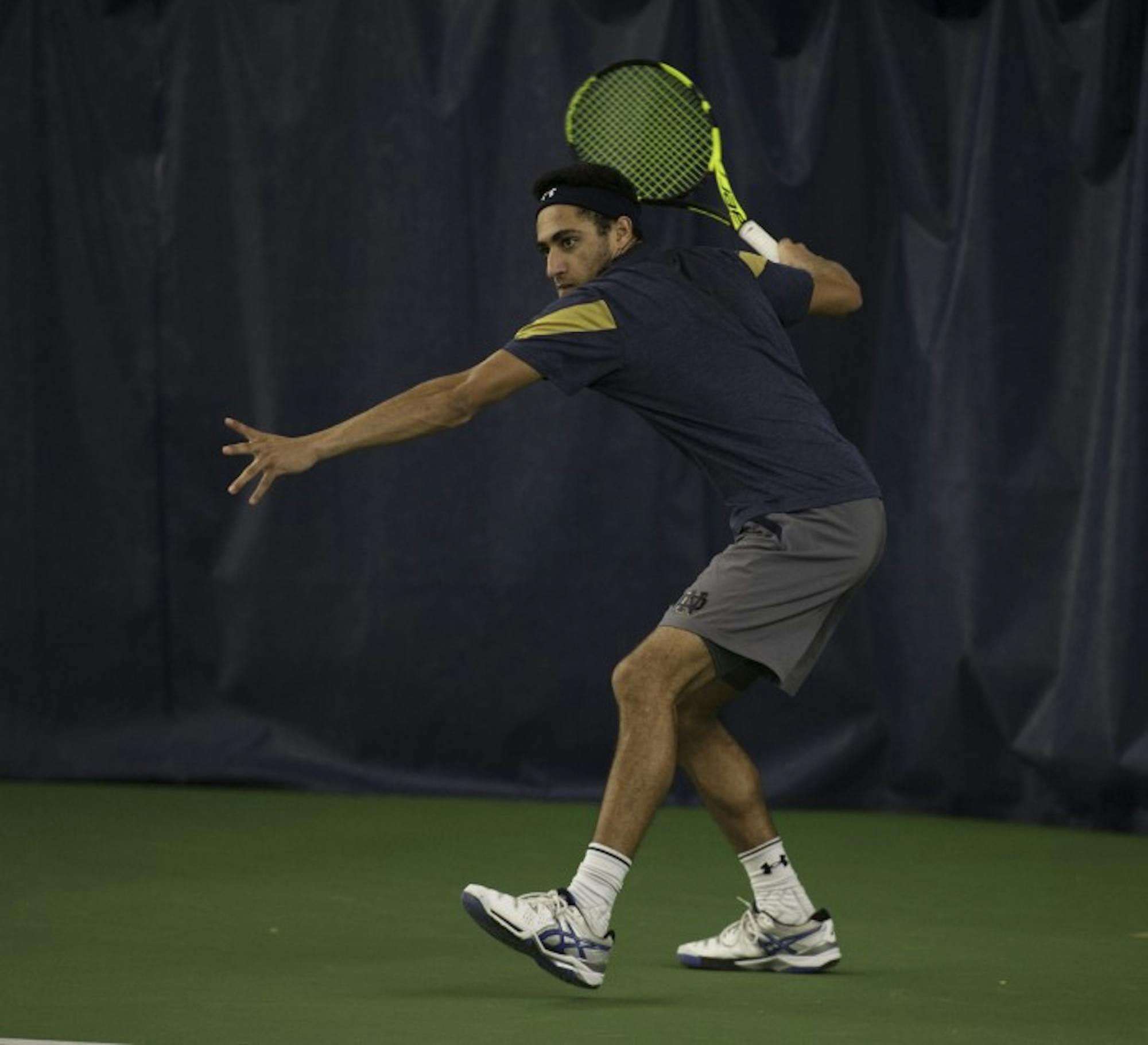 Irish sophomore Grayson Broadus prepares to hit a forehand during Notre Dame’s 4-1 win over Northwestern on Feb. 24 at Eck Tennis Pavilion. Broadus lost his doubles match to the Wildcats.