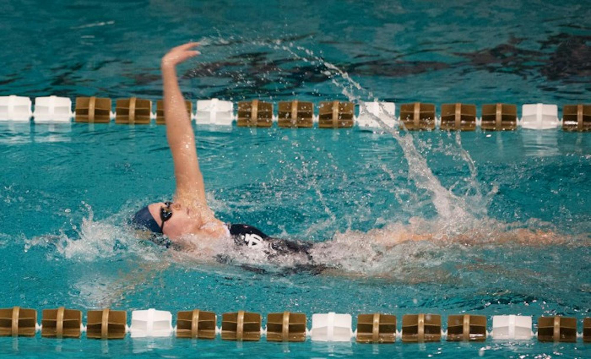 Irish junior Catherine Galletti powers through the middle of the 100-yard backstroke during Notre Dame's 219-60 win over Valparaiso on Nov. 15, 2013.