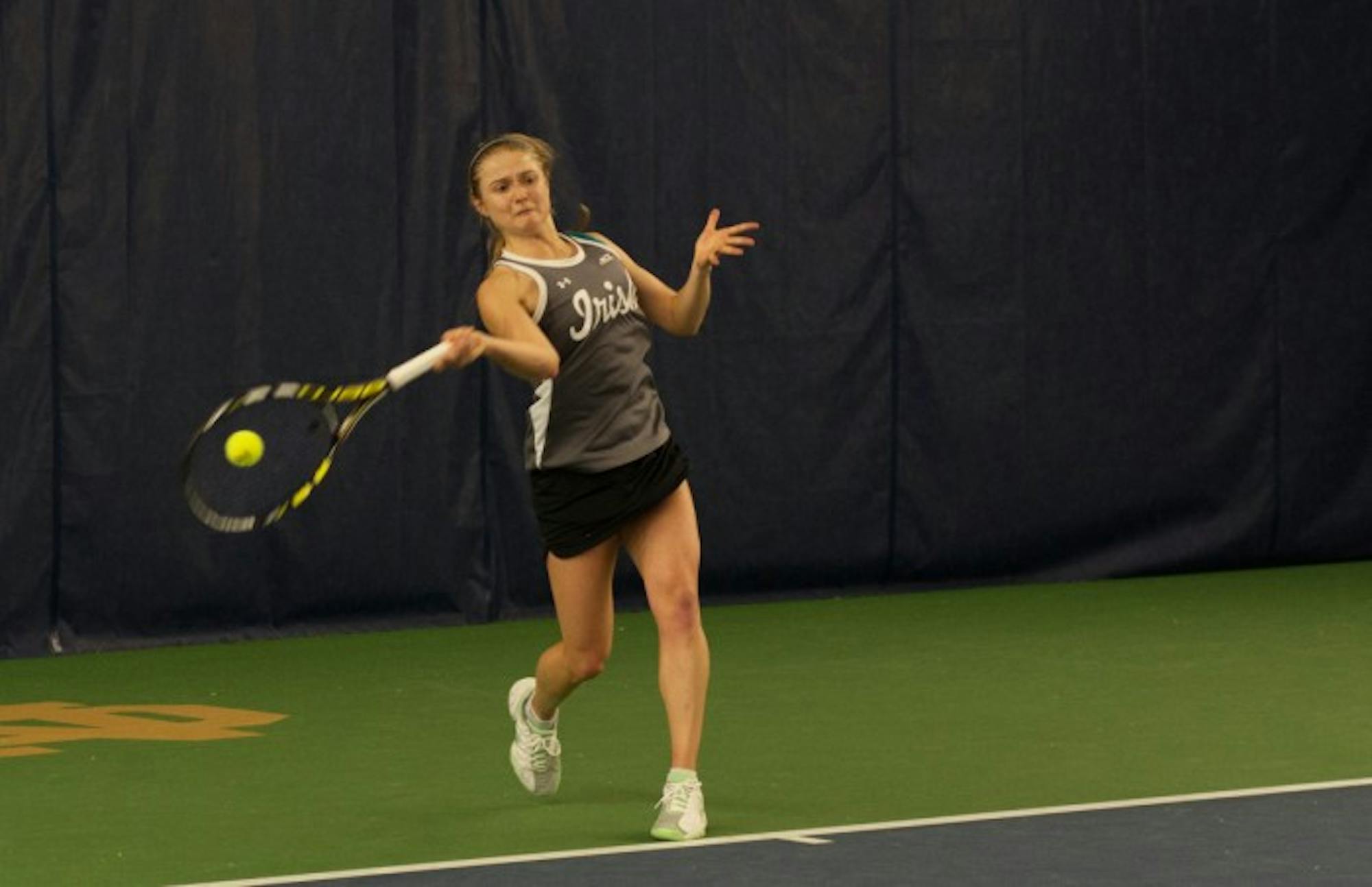 Irish senior Monica Robinson hits a forehand during Notre Dame’s 6-1 win over Indiana on Feb. 20 at Eck Tennis Pavilion.